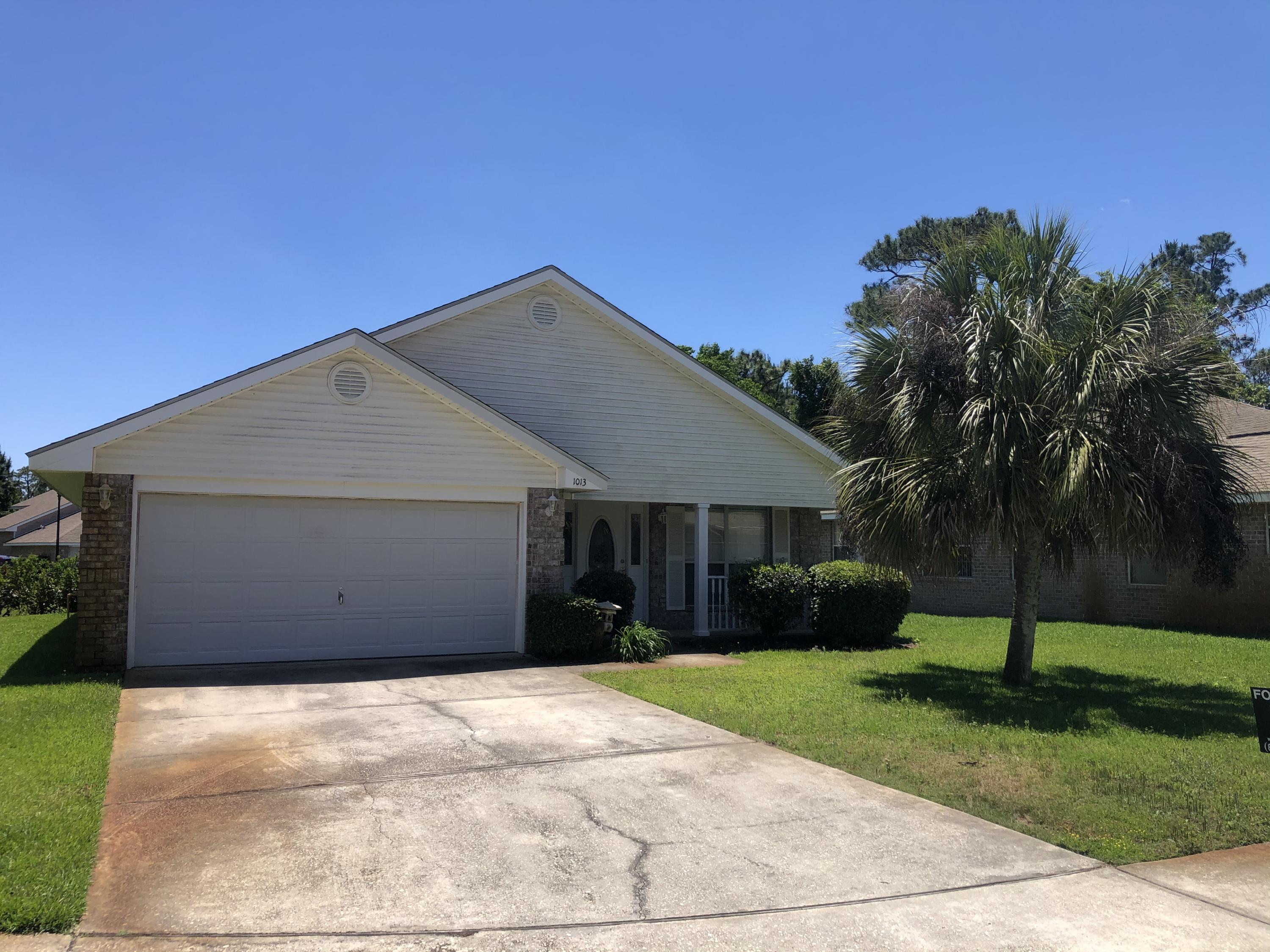 Charming all brick 3 bedroom 2 bath home with a 2 car garage in Marsh Harbor just minutes from Hurlburt Field. This home is on a corner lot in a great neighborhood that has sidewalks for your evening stroll. The formal dining room in the front of the house can be used for a dining room, extra living space or home office. The living room is divided from the kitchen by a breakfast bar which is great for entertaining. The vaulted ceiling and plant shelves add volume and dimension to the living area. This is a split bedroom floorpan. The master bedroom is spacious enough for a king size bedroom set and the master bath offers a deep soaking tub, double vanity and separate shower. The walk in closet is large enough for any clothes connoisseur.
