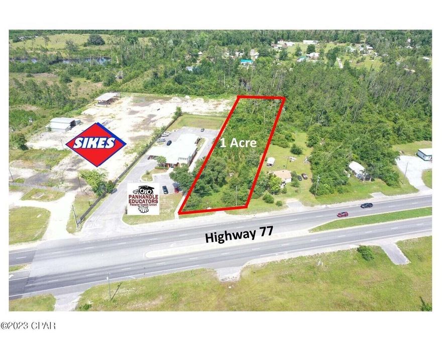 One acre on Highway 77 in Southport. Approximately; 111' x 557' x 98' x 508'. Located adjacent, and south of Panhandle Credit Union. Zoned C-3, General Commercial in unincorporated Bay County.