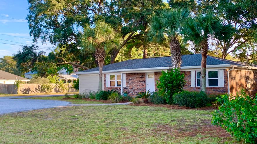 Corner Lot in Highly Desirable Holiday Shores Estates. Fresh Paint & Carpet. Kitchen renovated in 2017, stainless appliances, cooktop & granite. Open kitchen, Split bedroom floorplan. Extra large 95x125 lot is fully fenced, graced by a canopy of mature Oaks, Lemon Tree, Pineapple, Crape Myrtles & Traveling Palms. Large 11x18 Cover Porch may be easily screened. 2 Bayfront parks/boat launch nearby. Close to our gorgeous white sand beaches, Shopping, Restaurants, Excellent Schools, Hospitals, yet serene & away from hustle & bustle. Roof '14, Gutters '17, A/C in/out '19, Water Heater '14, Windows '15. Home Warranty. Termite Bond. Great for Primary Res. or $2,600/mo rental. Having Foundation ReVamp done by Mid Dec w/ 25 warranty! Seller can buy down interest rate points with acceptable offer.