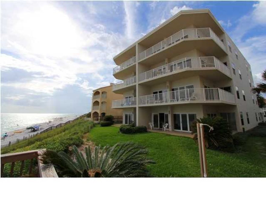 Motivated seller and a Rare opportunity to own a large 3Br gulf-front condominium in the heart of downtown Seagrove Beach at the private, intimate premier Sago Sands Condominium. Painted throughout in cool pastel beach blues/greens; New neutral carpeting May 2014 in LR/MBR/DR. New LR furniture July 2012. Carrera Marble kitchen counters. You will appreciate the ground floor convenience, and be amazed with breathtaking views of the dazzling white sand beaches and sparkling emerald green waters from the small bluff on which Sago Sands is perched. Wraparound patio offers superior sunsets as well as sunrises. Super spacious floorplan with 3 large bedrooms; 2 as you walk in on each side (one with 2 queen beds and another with a queen) and a very large gulf-front