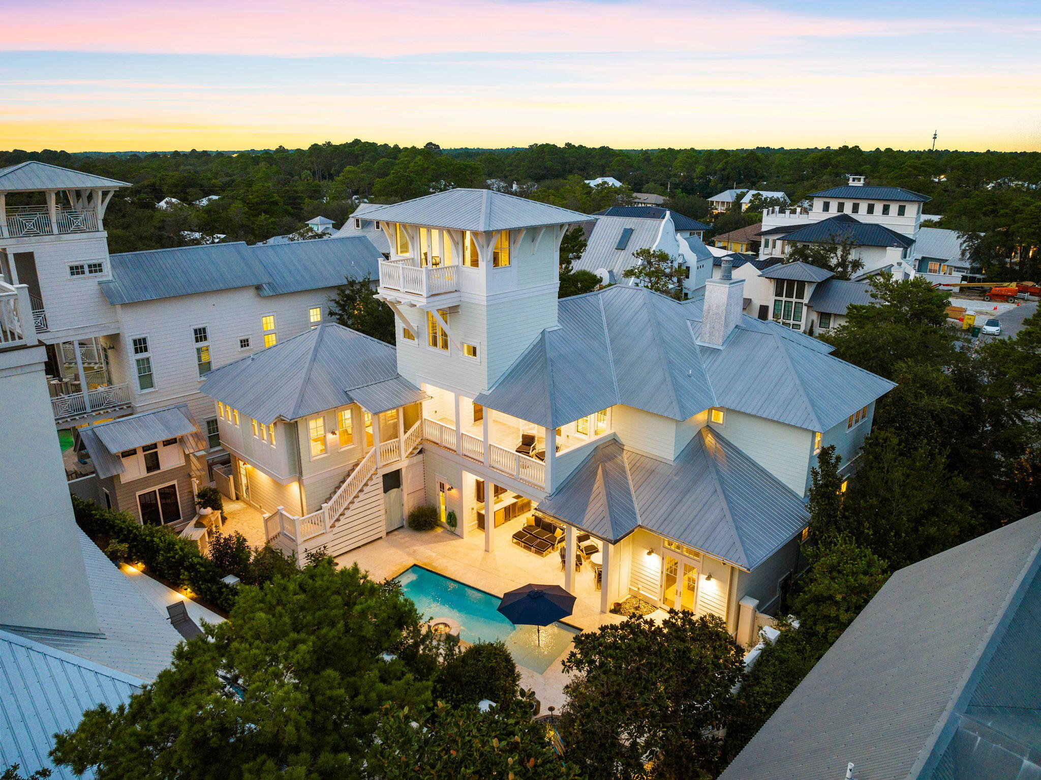 Exemplary coastal design juxtaposed ample privacy characterize this extraordinary beach side retreat ideally located in the heart of Old Seagrove within excellent proximity to beach access and centered between the neighboring communities of Seaside & Watercolor. Situated on an oversized quarter-acre lot, this beautiful custom-built home is finely appointed with professional interiors & decor curated by Alex & Cynthia Rice of Old Seagrove Homes. This elegant compound is comprised of six bedrooms & six and a half bathrooms including an attached carriage house outfitted with a full kitchen, living room, king suite and ensuite bathroom.