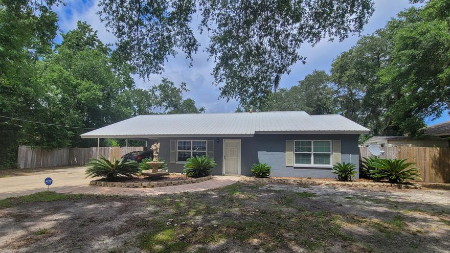 FANTASTIC HOME situated on a large lot in the center of Fort Walton Beach.  Uniquely updated floor plan with special features throughout. Spacious living area with plank laminate flooring and two large windows for natural light.  Dining area has shiplap walls, built-in shelves for decorative pieces and opens into the living area for easy entertaining.  Light and bright kitchen with lots of cabinets, counterspace, backsplash, stainless/black appliances and tile flooring.  Breakfast area has a door that leads out to the large covered patio perfect for cookouts this summer.  You will love this outdoor space with a firepit area, two storage buildings, fully fenced yard and plenty of pool for a future pool.  Master bedroom and bath has its own wing complete with a walk-in closet.  See More...