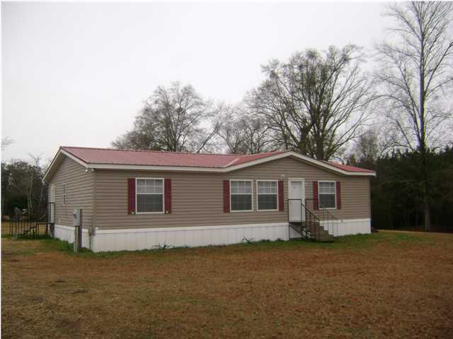 Located in North Walton County on 2 acres just West of Paxton and in the Paxton School District, an A+ school for all grade levels. Kitchen features an abundance of cabinets, breakfast bar, stove, dishwasher, microwave and refrigerator plus a pantry. Master bath has a double vanity, garden tub plus separate shower. All 4 bedrooms have walk-in closets. Laundry room is off of the kitchen. On the back is a 13 x 14 covered deck overlooking the fenced back yard. Includes a 10 x 20 storage building.