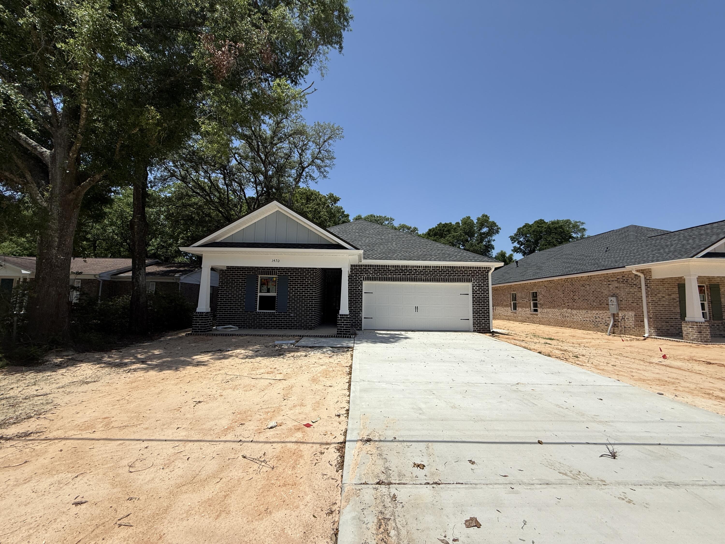 Act Fast! Home must be under contract by May 31 and close by June 30 to qualify for builder incentives! Incentives include coverage of Doc Stamps, Title, Final Survey, and 2% toward the buyer's closing costs. Don't miss out on these valuable savings! Move into this stunning new construction home featuring 5 bedrooms, 3 full bathrooms, including a versatile flex living area--perfect for creating lasting memories with loved ones. With 2,318 sq. ft. of thoughtfully designed living space, this home offers a modern yet charming atmosphere, ideal for multi-generational living. The well-appointed kitchen boasts granite countertops, a tiled backsplash, soft-close shaker cabinetry, pendant lighting over the island, and sleek stainless steel appliances. LVP flooring flows throughout the home, combining durability with style. Custom touches like crown molding, tray ceilings, and satin nickel hardware elevate the design. Enjoy lower energy costs with natural gas powering the heat, cooking range, dryer hookup, and tankless water heater. For added convenience, this home includes a privacy fence, blinds, and a refrigerator. Cabinets, countertops, and flooring are going in now - come check out these amazing finishes! Builder can close by 6/30.