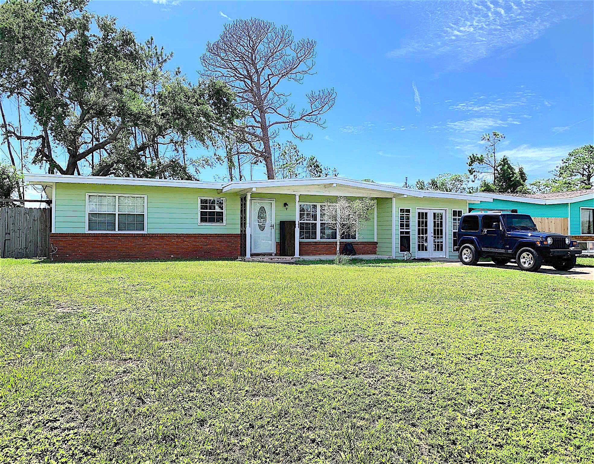This home has 2 bed rooms (could be 3 easily or an office area) and 2 baths. Highly desirable Woodlawn neighborhood near the bay, the Navy Base, Panama City and Panama City Beach. This would be a great home for someone who would like to do some work to the interior. New roof. New bathroom fixtures just installed. Plenty of room for storage. Park a boat in your drive or behind your gated side yard. A similar home down the street sold for $223K appraised which needed a lot of updating and a new roof. Call to see this home today before it's gone!!
