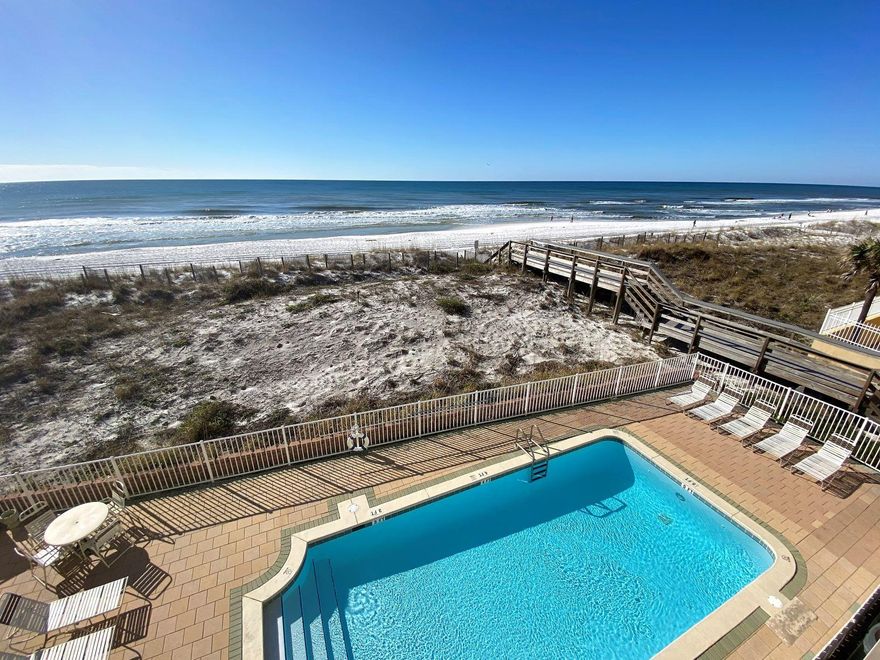 INCREDIBLE PANORAMIC VIEWS OF THE GULF! This beautiful designer fully furnished 2BR 2BA + hallway bunks is located in a quiet, private, low-rise complex with ONLY 10 UNITS allowing peace & tranquility inside & out. Condo has large owner's storage unit conveniently located outside the front door .. granite countertops.. stackable washer/dryer in unit, stainless steel appliances.. wood-look tile flooring throughout.. crown molding.. walk in closet.. hot water heater 2018.. unique & beautiful fiberboard wood-look ceiling tiles which create a sound barrier between floors. Blue Dolphin features a gulf front pool, sundeck, elevator, covered parking & a one of the quietest areas of the beach due to low density  condos nearby!