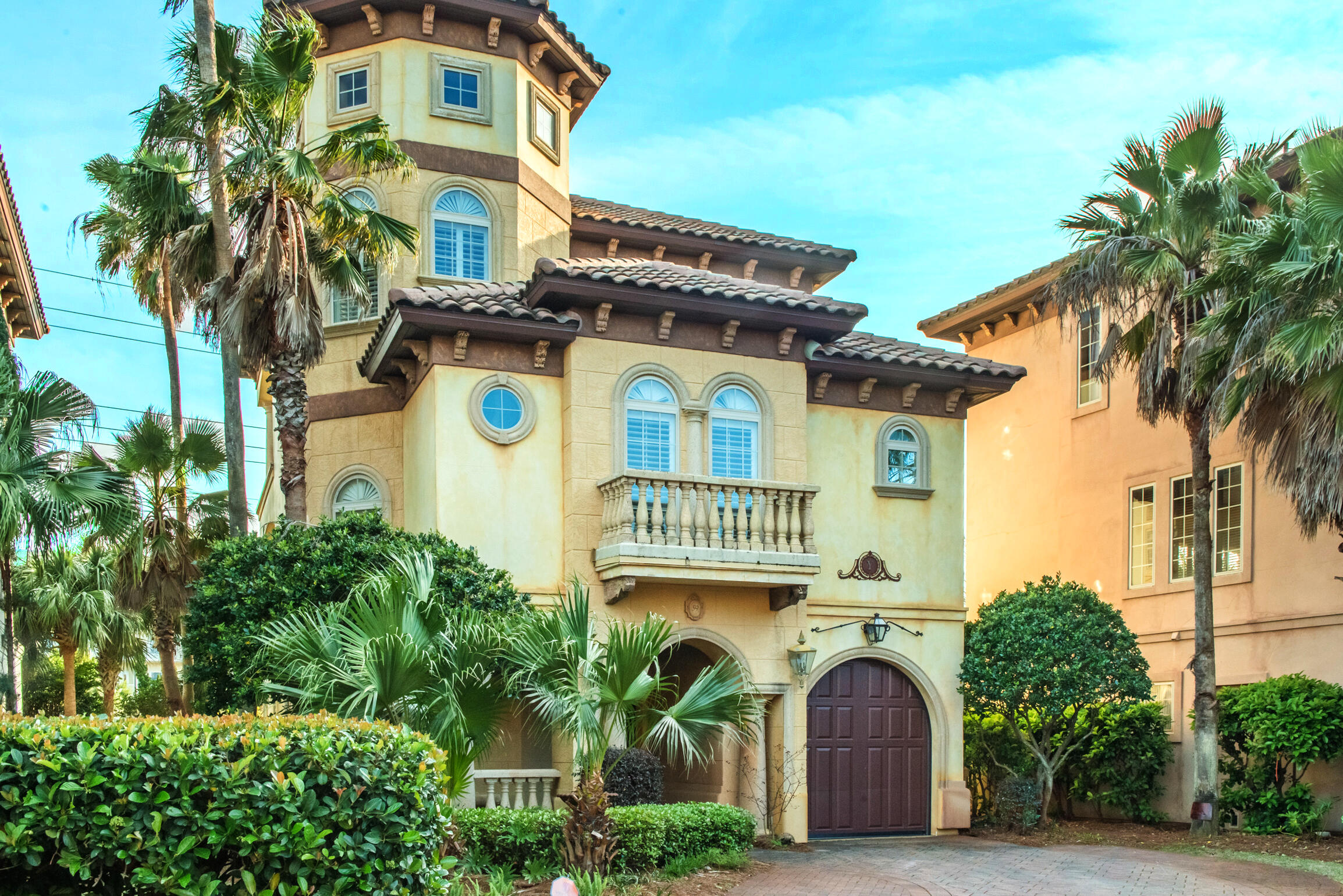 Villa Tuscana, premiere custom built home with open Gulf views from both floors. Owner had all walls, fixtures, floors, staircase, mirrors, wall sconces, custom done with unique one of a kind items. Walls are Venetian plaster. The whole top floor is the Master Suite with a bar, wine cooler & drawer fridge. The stain glass in the Master bath was over $30,000. High end appliances in the kitchen such as Sub-Zero/Dacor and gas range. The bar top in the Kitchen is a large thick piece of imported Australian Cypress cut all in one piece. Granite covers the rest of the counter tops. A beautiful three story freestanding spiral staircase also made of imported Australian cypress.