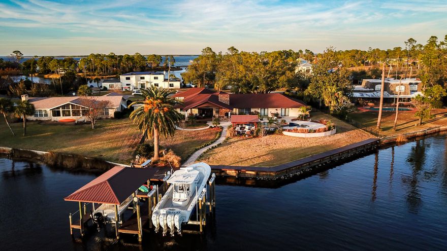 Stunning One-Story Home with 3 Car Garage In The Desirable Neighborhood Kings Point. The 4 Bedroom 3.5 Bath Home is 4,152 sqft  on a 0.79 Acre Lot with 156ft of Waterfront. BRAND NEW ROOF! NO HOA! The Home Is Completely Upgraded Offering Open Concept Living Spaces With The Kitchen, Living Area, and Master Suite all being Waterfront with Great Views of The Bay. This Property Is a Boaters Dream. The Home Offers a Chefs Kitchen with Top of The Line Wolf + Subzero Appliances. Gas Stove and Fireplace. Granite Countertops Throughout The Entire Home. Huge Home Office. 2 Laundry Rooms. Outside is a Summers Kitchen. Pool and Waterfall Hot-tub. Relaxing Waterfront Gazebo w/ Fire-pit. Top of The Line Boat Dock with Two Boat Lifts and a Jet-ski Floating Dock. 500 Gallon Fuel Tank and Ice Machine.