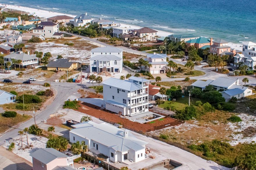 Beach Bliss! Secluded within the captivating charm and nostalgia of Gulf Pines resonate deeply in this carefully planned and positioned 6 Bedroom, 7 bath resort style residence. A professionally designed new construction, this magnificent vacation destination capitalizes on our area's greatest commodity, breath taking views of the beautifully pristine beaches along the Emerald Coast.Here is your chance to own a magnificent home in a private gulf-side community with deeded access less than a stone's throw. This premier vacation destination exemplifies the coastal lifestyle capitalizing on the coveted ambiance of luxury living. This uncommonly large lot holds 5200 sqft of multifaceted entertainment and lodging capabilities. Three separate living spaces, one on each floor, cover the