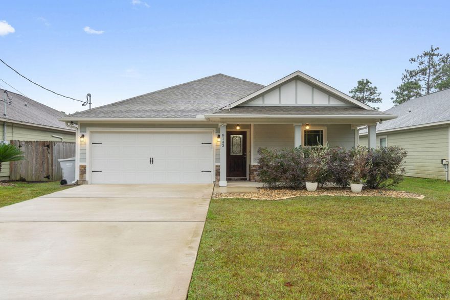 Experience coastal charm in this 4-bed, 2-bath retreat, just a short drive to the beach. Tray ceilings and crown molding add sophistication, while the kitchen showcases granite countertops, stainless appliances, and a wine fridge. The master suite offers a separate tub and tile shower for relaxation. Outside, a covered patio and fenced yard beckon for leisure. Enjoy a welcoming front porch and a climate-controlled garage with epoxy flooring, ideal for a flex room or gym. Plus, seize the opportunity with a VA assumable mortgage at an unbeatable 2.375% rate. Your ideal home, where beachside living meets comfort!