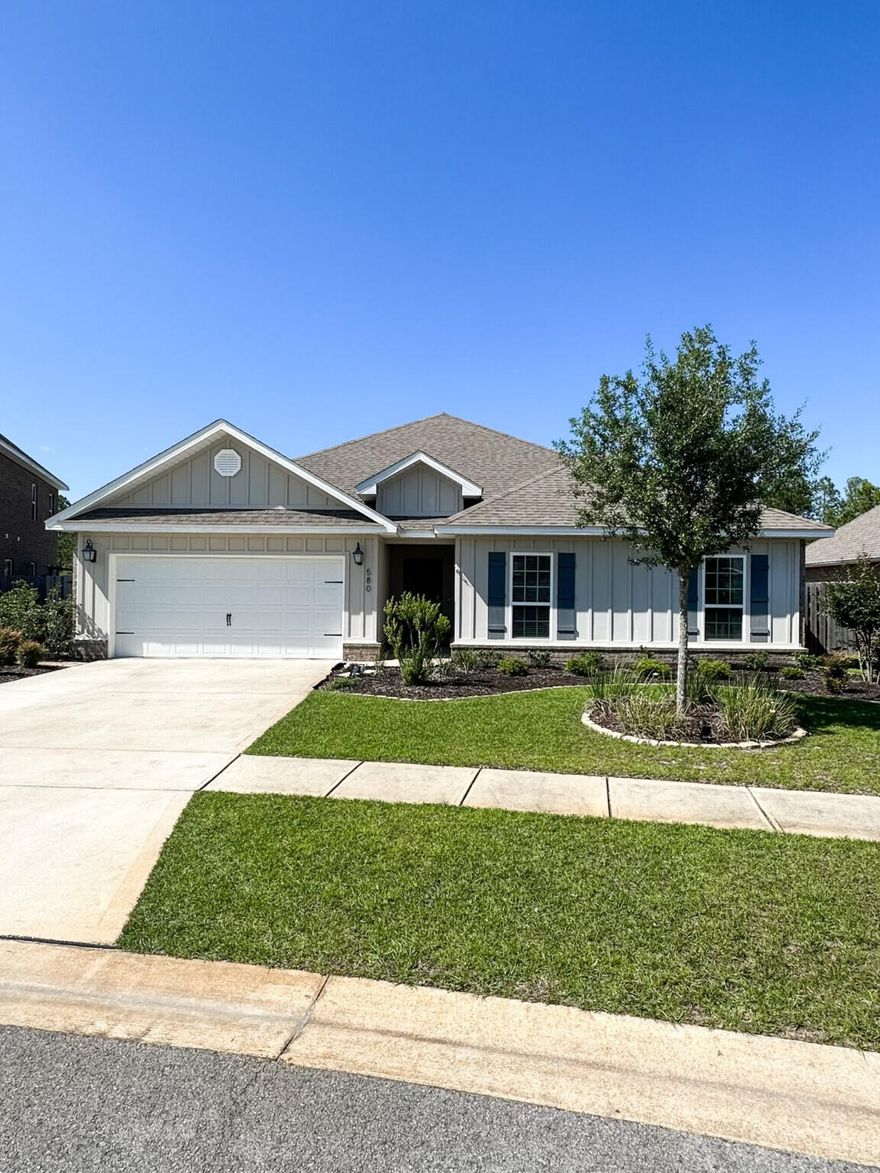 Discover your dream home at 580 Cornelia Street in Freeport, FL. This 2,318 sq. ft. Craftsman-style residence with upgraded coastal-colored LVT flooring and granite countertops is located on a fenced premium lot features 4 bedrooms, 2.5 baths, and an open-concept living, kitchen and dining area creating a very spacious feeling. The living area with additional area for family gaming enhances the living space. The spacious kitchen with Island overlooking the living area and dining, is perfect for entertaining or gathering with family and friends. The kitchen is a culinary delight for those who love to cook and entertain as it boasts stainless steel appliances, including a five-burner gas stove/range, dishwasher, microwave, and walk-in pantry. The master suite boasts a large walk-in closet and luxurious bath including a tiled shower, soaking tub and a double sink vanity. The home also features three more nicely sized bedrooms, offering comfort and space. The oversized laundry features additional storage. Enjoy upgraded interiors and a private fully fenced backyard that backs onto a fishing pond for added privacy and fun. The backyard makes you forget you are in a planned community! The Central Park neighborhood of Hammock Bay also boasts its own "Central Park" with an outdoor kitchen and gazebo, providing the perfect setting for outdoor gatherings and events. Nestled in the amenity-rich Hammock Bay community, residents have access to pools, RV/boat storage, sports courts, a clubhouse, trails, bay pier and more. The Resort Style Living at Hammock Bay features two zero-entry pools, a 10,000 sq. ft. clubhouse, and a rentable event center. Active Lifestyle amenities include exercise facility, tennis, pickleball, basketball courts, a movie theater, and trails for hiking and biking. For fun there is a large playground and access to the Freeport Sports Complex that caters to all ages. You can have peace of mind with the gated community with security guards to ensure privacy. Embrace the charm of Freeport, with its natural beauty, small-town atmosphere, and a friendly community with a laid-back lifestyle. Explore Florida's recreational paradise and natural beauty thanks to its warm subtropical climate and close proximity to beaches, state parks, and the stunning Choctawhatchee Bay. Freeport is a burgeoning area offering a mix of tourism, real estate, and local businesses. Your New Life Awaits!