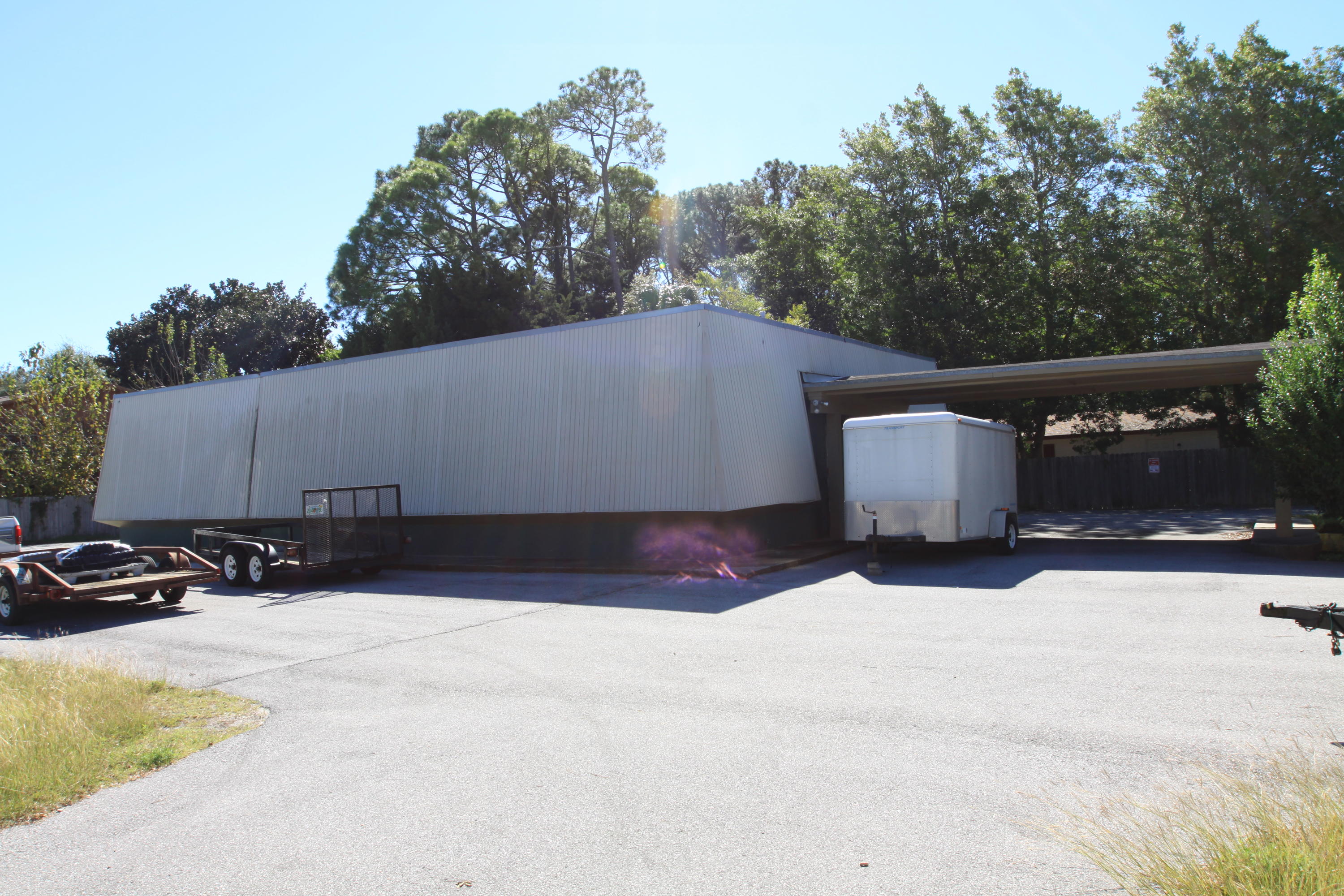 2520sf office/ warehouse building in Fort Walton Beach for lease or lease/ purchase. This property consists of multiple office rooms, conference room, kitchen, lobby, storage room and small warehouse area. Located on a corner lot with great access and plenty of parking. Seller says that the space use to be a large open area used as a dance studio and that the walls could be removed if necessary. Great location for a church, daycare, studio etc.