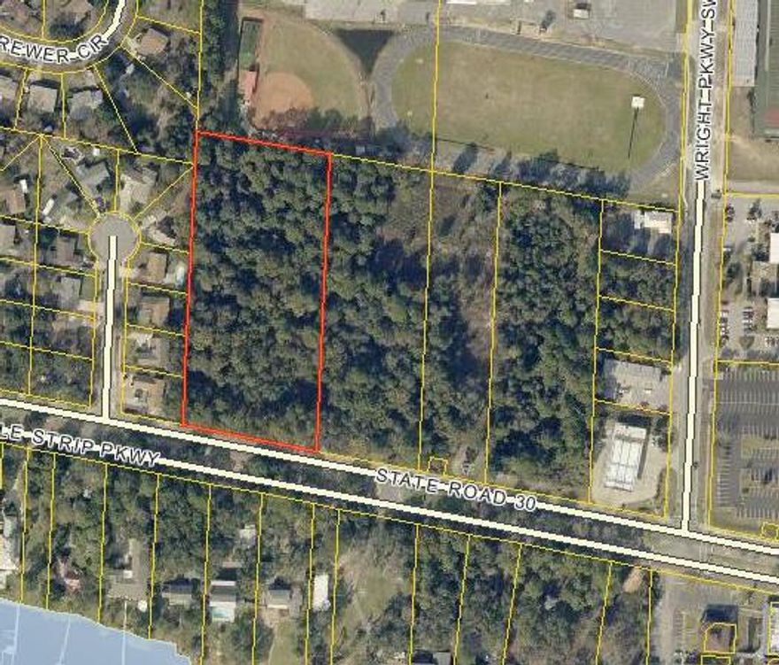 7.79 acre Commercial Land on High Traffic Corner of Wright Pkwy and Miracle Strip Pkwy near Fort Walton Beach High School. Four parcels combined; perfect for commercial development.