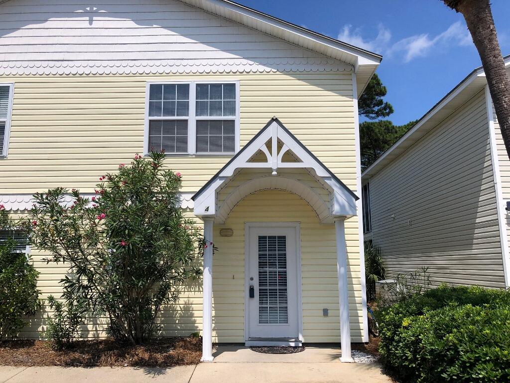 ADJUSTED PRICE on this wonderful townhouse community just just a short distance from THREE public beach access points and in the heart of some of the best entertainment Destin has to offer!! This townhome has been updated with tile flooring and granite counters downstairs and there are two full bedrooms each with their own private bath upstairs. This is a well maintained 30-unit complex that allows short term rentals. There is a large lake in the rear of the unit for your enjoyment as you relax in the screened porch and enjoy the gulf breezes. Or you can cool off in the community pool just steps away. Enjoy the good life and make a wise real estate investment in the Destin area! HVAC system was replaced in 2016 and the water heater in 2005.. Seller is offering a $5000 flooring allowance!