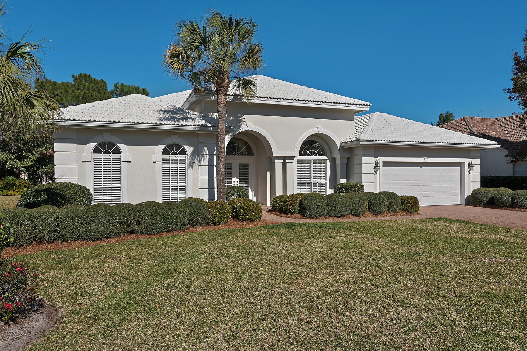 THIS IMMACULATE ARTHUR RUTENBERG DESIGNED ''CARIBE'' MODEL HOME IS NESTLED ON A LAKEFRONT LOT IN THE GOLF COURSE GATED COMMUNITY OF EMERALD BAY. HIGH CEILINGS WITH CROWN MOLDING,PLANTATION SHUTTERS THROUGHOUT, SPLIT BEDROOMS, CEILING FANS,SECURITY SYSTEM, STUDY/OFFICE, SCREENED LANAI, FIREPLACE, TWO ZONE AIR CONDITIONING & HEATING, LARGE OPEN KITCHEN WITH CENTER ISLAND, GAS HEAT & HOT WATER, CENTRAL VAC SYSTEM, NEWLY UPGRADED HVAC SYSTEMS, GAS WHOLE-HOME BACK UP GENERATOR, LARGE HEATED POOL WITH HOT TUB, COVERED PATIO AND MORE. A MUST SEE !