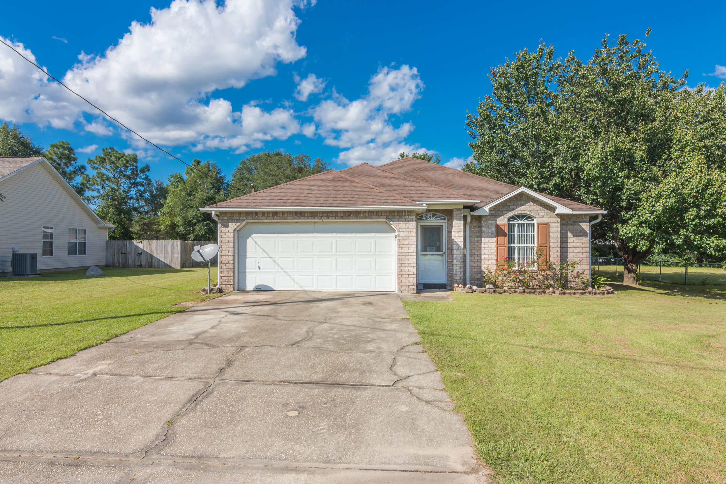 Smart Address- Located South of I -10 ...this spacious floor plan has family, gathering & entertaining in mind. Large living area, with formal dining/office/hobby area. Eat-in kitchen w large pantry, opens to huge covered deck for bbq's or quiet coffee in the morning. Indoor laundry room convenient to bedrooms. Green yard building has electric (brown yard building does not convey). Sprinkler system w well (conveys ''as is''). New septic lines 2020Worth seeing fast & make it yours!