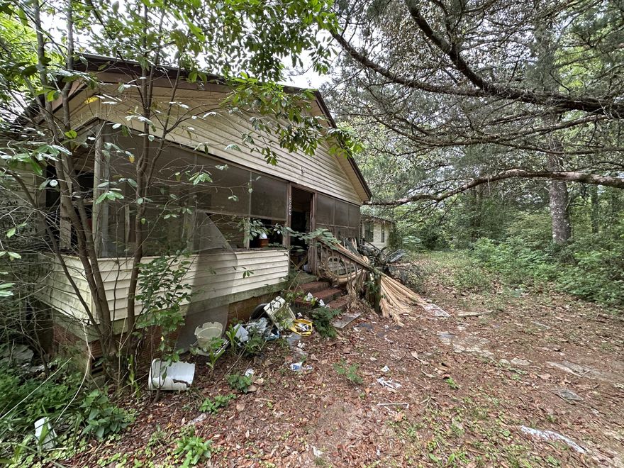 This opportunity wont last long!!! Fixer Upper!!!  3Bed/2Bath Approximate 1944 sqft heated/cooled with a metal roof Zoned as AC.53 septic tanks with two being operational. This 2+/- AC property features  6 beautiful pecan trees with 1 being a paper shell and Catawba trees.  LOCATION LOCATION!!! This property is Minutes away from Lots of new growth and just a short drive from local schools, hospital, south Publix, a variety of restaurants and the upcoming Crestview Commons, Hwy 85 and I-10 are in close proximity to the property.USE CAUTION** Floors may fall through.