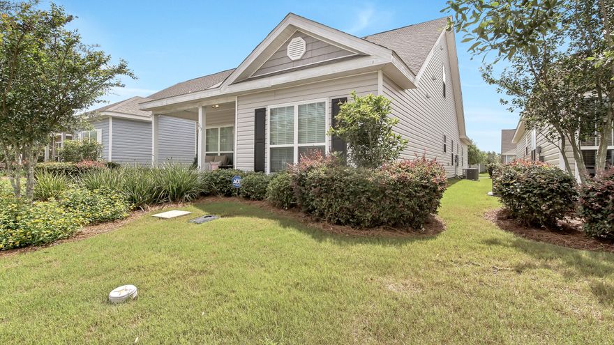 Enjoy your morning coffee on the rocking chair front porch. This charming home is nestled in the heart of Hammock Bay and ready for a new owner. Home boasts a wonderful open floor plan-perfect for entertaining. High ceilings and large windows make for a welcoming entry. Beautiful living area with room for full furniture sets. Kitchen with island is ready for your next culinary masterpiece. Large main floor Master with room for oversized furniture. Master Bath has double vanity, huge shower and walk in closet. SIzable main floor secondary bedroom with full bath close by. Upstairs features two secondary bedrooms with tons of natural light and a shared full bathroom.Hammock Bay offers world class amenities in a resort style atmosphere. Cable and lawn care included in HOA fees.