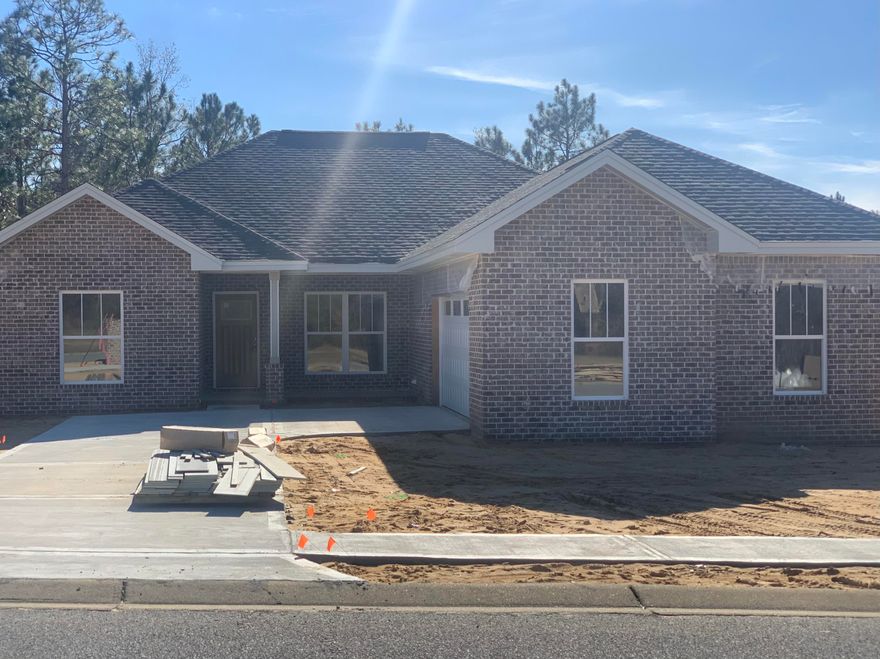 ALMOST COMPLETED! All brick custom home! Location Location Location! Just north of Crestview High School, Davidson Middle School, banks, movies, restaurants, Winn Dixie and the new Publix!! New home large lot! 3 Bedroom, 2 Bath home with many upgrades! Premium counter tops, custom built showers, and free standing tub in the master bedroom!! Allergy and pet friendly! All tile throughout the home (NO CARPET!)  Cathedral ceilings. LARGE KITCHEN! Under construction. Irrigated lawn! Come home today! Local custom builder. See photo section for floor plan!