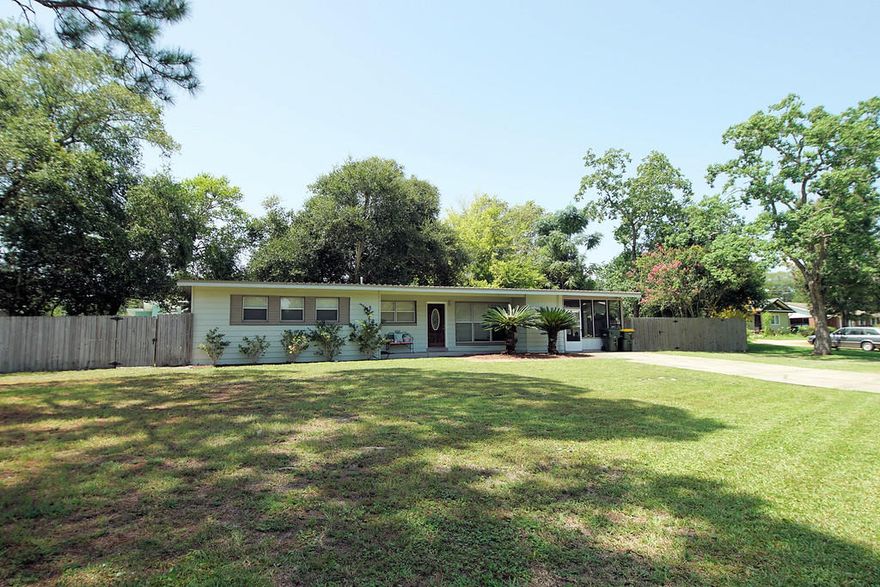 Beautiful 3 bedroom, 2 bath home in great Golf cart friendly community on very large lot. Cart ride to all of downtown Fort Walton Beach. Low maintenance metal roof, vinyl siding, newer insulated vinyl windows, newer wood and tile floors. Carpeting in the bedrooms, newer kitchen with self-closing cabinets, new countertops, disposal and dishwasher. All new fans, light fixtures and blinds too. There is copper wiring throughout. This house has an open floor plan with plenty of storage space. The bathrooms have been renovated with new vanities, tile floors, new toilet, and the master bath has a beautiful walk-in tiled shower! An added bonus with this house is the large screened porch with all new screening great for outdoor living space! Schedule your appointment to see this home today!