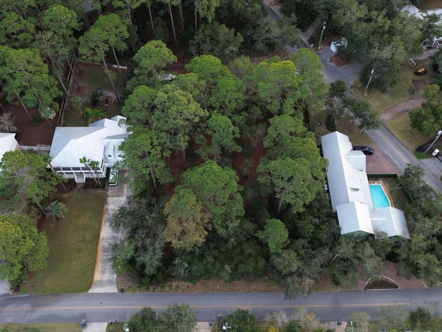 Conveniently positioned just off East Hewett Road between Scenic Highway 30A and Sandestin Golf and Beach Resort, this .275-acre homesite offers an exceptional opportunity to create a custom coastal retreat with proximity to the bay and everyday conveniences. Located directly across the street from Choctawhatchee Bay, the property offers peaceful water views and easy access to the boating lifestyle, with water access at the end of Bay Circle and a nearby boat launch visible from the lot. The homesite is flat and build-ready, framed by a beautiful canopy of mature shade trees that provides natural privacy and timeless character. The setting feels established and serene while remaining close to the beaches of South Walton, Point Washington State Forest, and Topsail Hill Preserve State Park. Shopping, dining, and daily essentials are easily accessed at Grand Boulevard, along with Publix and Sacred Heart Hospital, creating a location that supports both relaxed living and practical needs. An added advantage is the seller's ownership of the adjacent lot, offering a rare opportunity to purchase both Lot 10 and Lot 11 for a combined homesite exceeding half an acre. This flexibility opens the door to a larger estate footprint, enhanced privacy, or a strategic investment opportunity. With bay views, boating access, mature natural surroundings, and proximity to 30A, this property presents a compelling canvas for coastal living.

