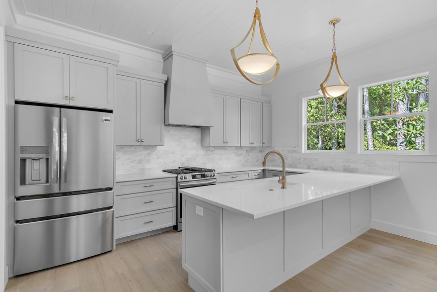 Stunning custom Florida cottage located in beautiful Point Washington, just minutes from Grayton Beach and Seaside.   This 3 bedroom and 3 1/2 bath home boast a garage, shiplap walls, custom cabinets, quartz countertops, hardwood floors, gas range as well as many more designer upgrades and finishes.  This home is located in the highly desirable neighborhood of Grayton Bayou.  Neighborhood has a community pool with waterfall and hot tub, dock and park on the bay off E Mitchell Ave, a boat launch at the end of Riker Ave and is only minutes to the beautiful beaches.  Buyer to verify all dimensions.
