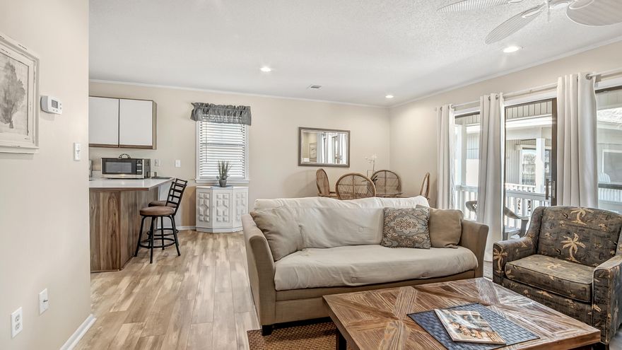 Located in the heart of Seagrove you will discover this one bed/one bath condo with peek views of the gulf located in Beachwood Villas which offers two pools (one heated),lighted tennis courts,shuffle board,community room with laundry room,outdoor cooking areas,playground,and wood boardwalks throughout the complex.Condo is situated closest to 30A and public beach walkover just steps away for easy stroll to the emerald  waters and white sands of the Gulf of Mexico.Rental ready with queen bed,pull out couch,and one bunk.Easy walk to area resturants,shopping,convienent store, and new public beach access under constuction with parking and restrooms..Nice size covered patio overlooking the common areas to sit and relax after a long day at the beach.