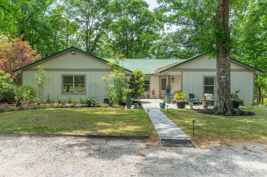 WATERFRONT x 2: Welcome to this charming 3-bedroom, 2.5-bathroom home nestled on a picturesque 10.8-acre property boasting tranquility and natural beauty. Just south of DeFuniak Springs, this property is located in the perfect area for easy access to town or only a little further South to Freeport. It is only a short drive south to the beautiful white sandy beaches of South Walton. Situated in a serene country setting, this recently renovated home offers a blend of modern comforts and southern charm. Stepping inside you will notice a seamless design meets inviting warmth in this open floor plan kitchen and living room area. As you step into this beautifully appointed space, you'll immediately notice the effortless flow and welcoming atmosphere, perfect for both entertaining and