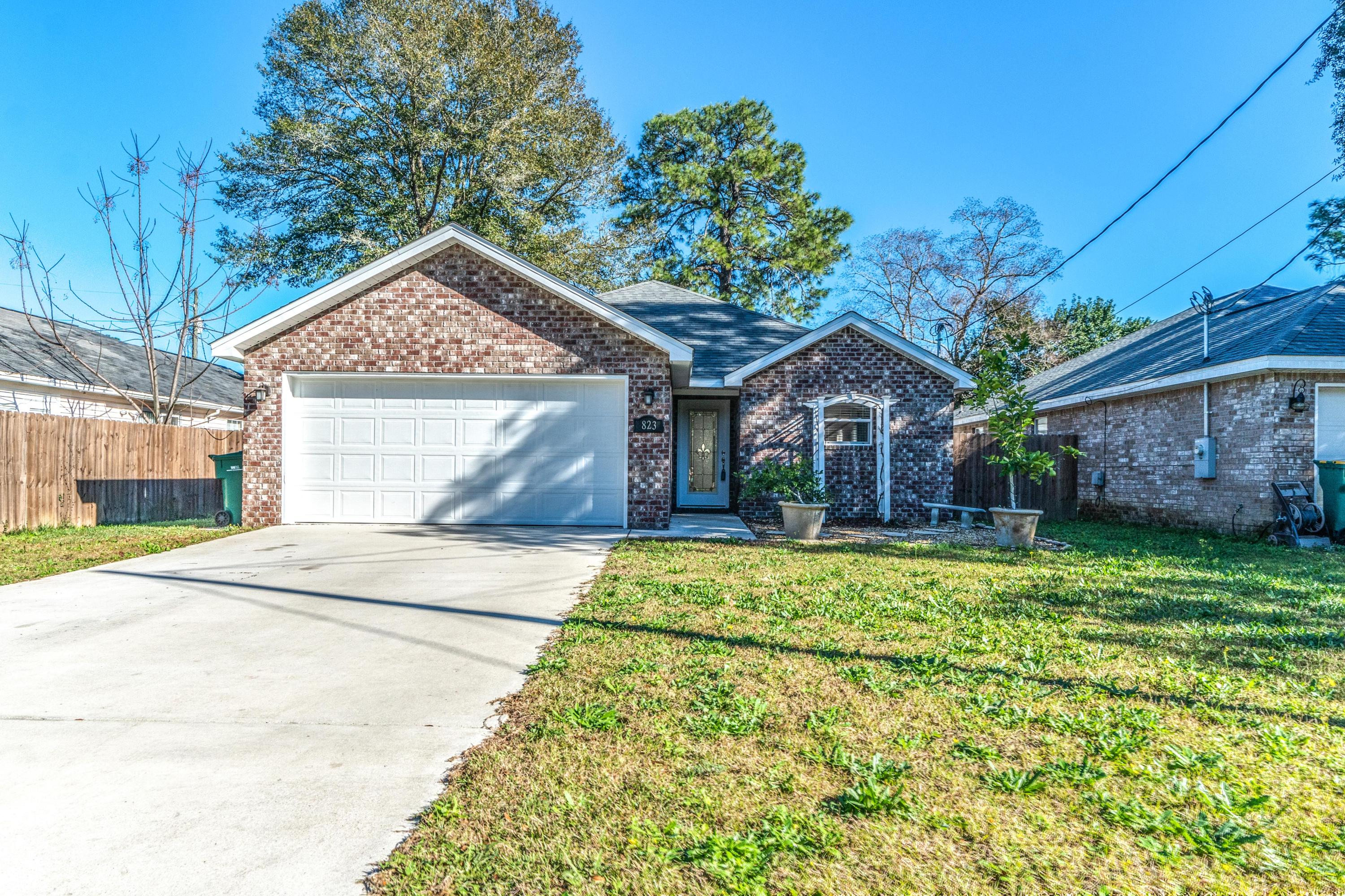 Nearly new home in the heart of Fort Walton Beach, close to shopping, restaurants, Hurlburt Field and Eglin AFB. Home has been well maintained and is fully fenced with a good sized backyard and lanai. The open floorplan is great for entertaining. Tile floors throughout the main living areas and inside laundry. Stainless steel appliances, granite countertops and a lovely backsplash in the kitchen. The master bedroom boast a large walk-in closet and lots of natural light. Out front there is an arbor with a muscadine grape vine and potted citrus trees. Don't delay call to see this home before it's gone.