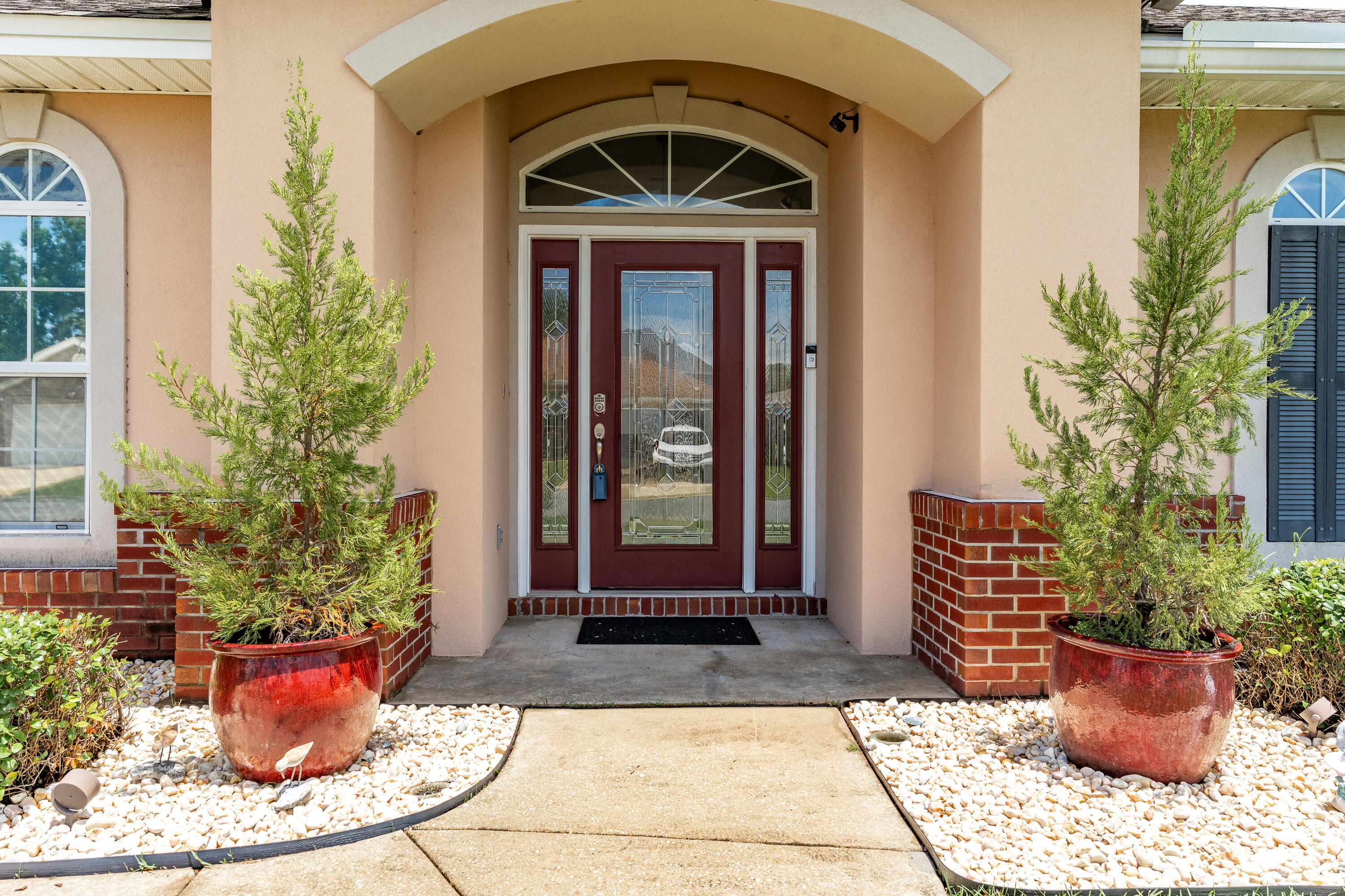 OPEN HOUSE SATURDAY 10-12!!!! This home is nestled in a beautiful neighborhood between Eglin AFB and Hurlburt Field. Save time and money being so close to everything! This spacious home boasts over 2,700 sq ft! PLUS, no worries about the roof (2021), pool pump (2023) and 2 HVAC systems (2023)! This contemporary home features a first-floor primary bedroom with convenient access to the laundry room. Downstairs, you'll also appreciate the blue tooth, surround sound speaker system, engineered hardwood floors and custom wine bar. Don't miss the sleek gourmet kitchen with breakfast bar, pantry, custom maple cabinets, black pearl granite and stainless backsplash and appliances. Entertaining will be a breeze in the massive great room off the kitchen. Step outside to your private oasis! > You'll enjoy splashing around in your low maintenance, salt system POOL! Lounge around on the deck and no worries about splinters with this composite decking. There's also a natural gas connection for grilling and artificial turf, so no mowing needed out back! Upstairs has so many possibilities - make it 2 bedrooms and a bathroom or a game room or gym or office. You'll also find a convenient walk-in attic storage area upstairs for your out of season items. Quality construction details like impact glass windows, tankless water heater, three-coat stucco claddings and 2X6 framing. Hospital is less than 1 mile away, shopping close by and A+ Liza Jackson is across from the neighborhood. Underground utilities are a bonus too! Don't delay and call your Realtor today!