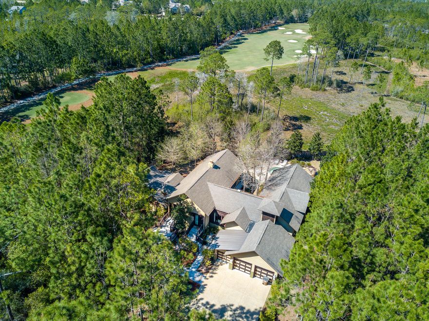 SWEET DEAL on Sweet Bay! Priced for fast sale! Incredible custom home in coveted Wild Heron. Located on the 8th hole at Shark's Tooth with great outdoor space and pool.