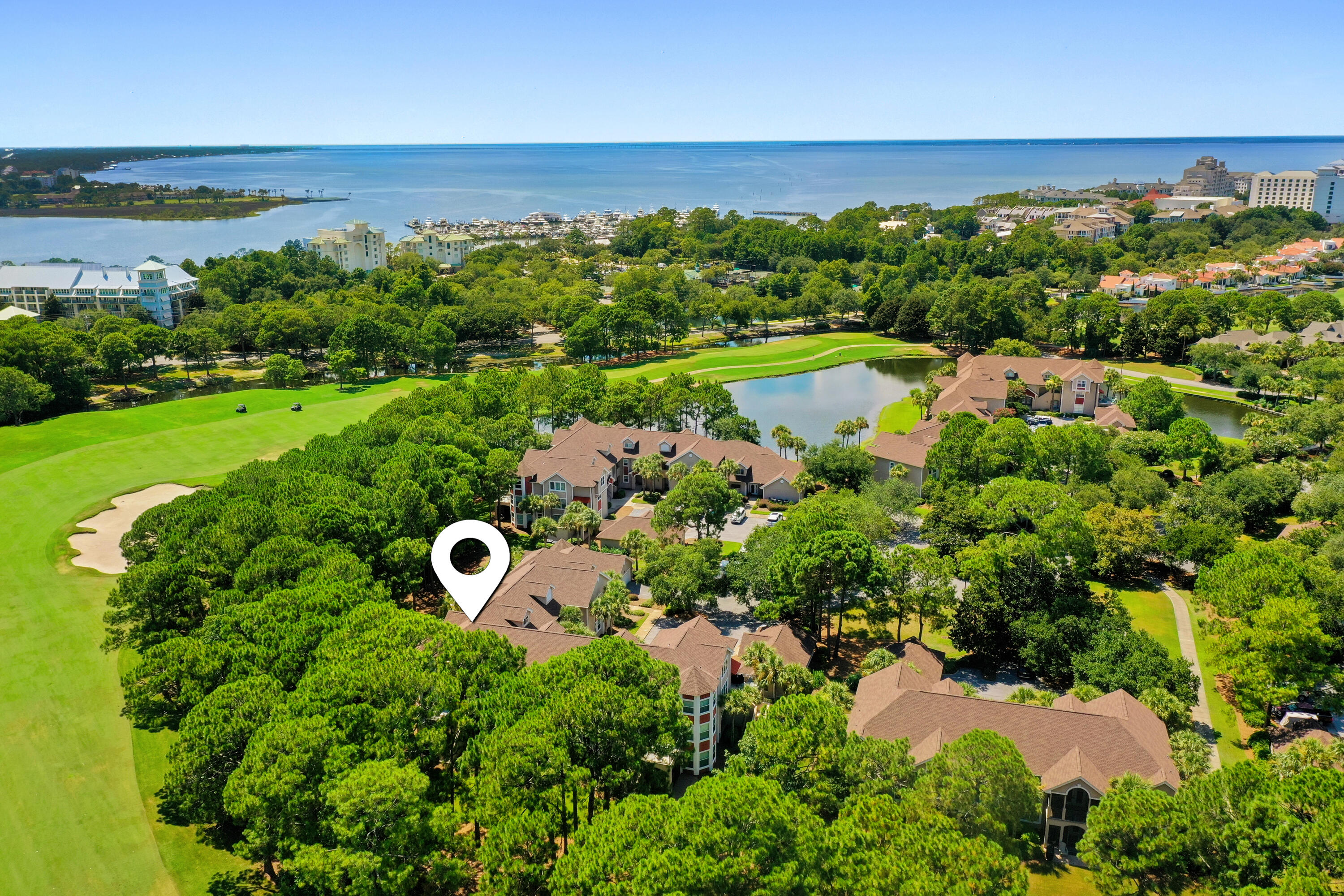 LOCATION, GARAGE & FULLY FURNISHED! This spacious Turnberry 3-bedroom, 3 Bathroom one-level condo is conveniently located on the first level, NO STAIRS! Spacious open-concept living and dining areas are tastefully decorated with coastal-inspired furnishings. Located on the 9th hole of Sandestin's Baytowne golf course and steps away from the Raven clubhouse. The kitchen features newly updated stainless-steel appliances, a Breakfast bar, and a large walk-in pantry with amazing storage. Enjoy stunning golf course views from your own screened-in patio, perfect for savoring morning coffee or grilling up a perfect dinner. This condo includes a large exterior storage, an interior owner's closet, and a private garage, providing secure parking and extra storage space for all your beach gear! This condo is across the street from the Marina, Tennis & Pickleball Center, two Pools, and the Baytowne Village. Experience all that Sandestin Golf & Beach Resort has to offer, from world-class golf and pristine beaches to shopping, dining, and entertainment,all just moments from your front door. Whether you're seeking a second home, investment property, or your own piece of paradise, this Turnberry condo is an exceptional choice.