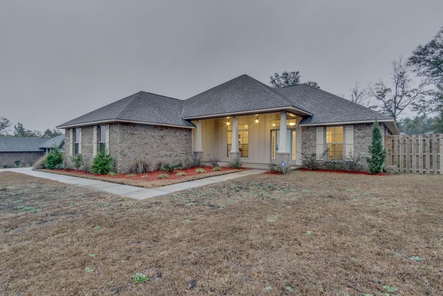 Gorgeous home less than 2 years old and positioned on a 1/2 acre lot! This beauty is a short commute to bases and the amenities of town. Large, open floor plan with high ceilings greets you upon entry. Flooring throughout consists of hardwood, tile, and carpet. Split bedroom floor plan provides two bedrooms on one side of the house, with an optional fourth bedroom in the rear of the home. Granite counters are found in the kitchen and bathrooms. Master suite features spa-like features with large, tiled walk-in shower, and 5' drop-in tub with tile surround. Huge Florida room allows space for a media room, man cave, playroom-so many possibilities. This home is move-in ready and available!Measurements are approximate and all information deemed important to be verified by buyer.