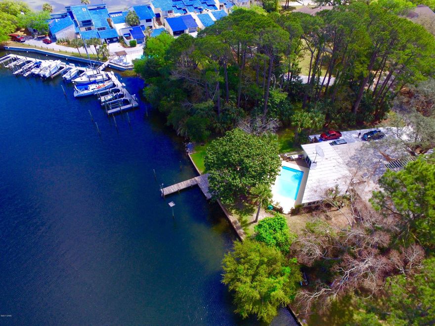 ATTENTION BIG BOATERS! This Panama City Beach Waterfront home has 110 ft on DEEP WATER! Perfect for your BIG BOAT OR SAILBOAT! Dock your boat behind your home and enjoy incredible open water views from this spacious waterfront sanctuary. This well cared for home has 4 bedrooms, 5 baths, office, living room, dining room, great storage and an awesome family room. All of this sq ft and all ONE STORY living. Lots of light and views from almost every room. Kitchen with huge walk in pantry, 2 master suites, 3 fireplaces, lots of built ins, 2 car garage with oversized drive for extra parking are just a few of the features. You are going to love the family room on the back of the home. This home has been a lifetime of hosting and entertaining. Call today and make this house your HOME!