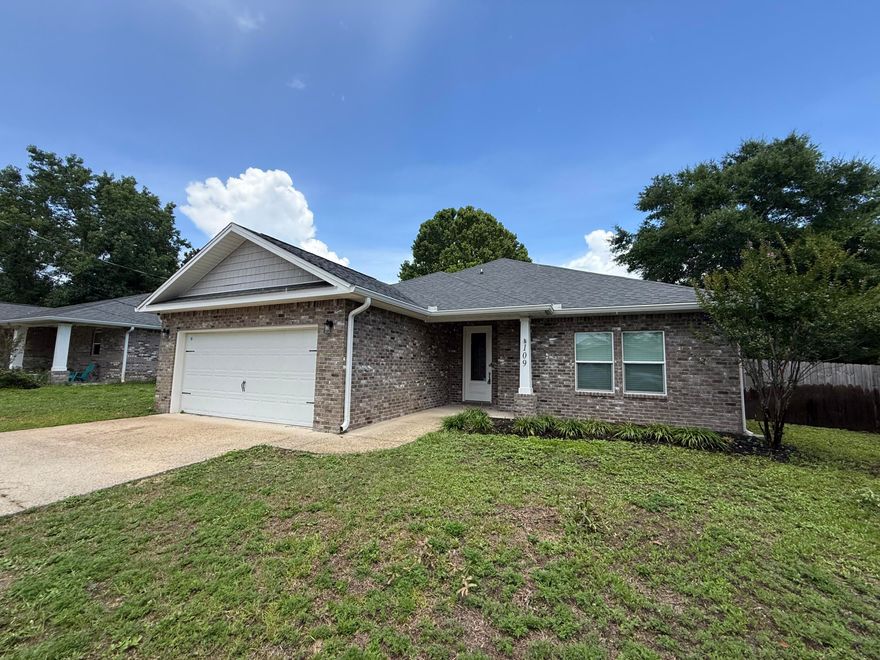Welcome home to this stunning 3 bedroom, 2 bath nearly new home in Mary Esther with no HOA! Conveniently located on the Emerald Coast and a short commute to Hurlburt Field you'll love this beautiful property which has all the updated finishes you've been looking for. The kitchen is a dream featuring granite countertops, a convenient breakfast bar, elegant wood cabinets and hardware, and quality fixtures like soft close drawers. Wood-look tile floors flow seamlessly through the foyer, kitchen, baths, and laundry room, adding warmth and durability throughout the home and you'll absolutely love the double trey ceiling in the spacious living room adorned with crown molding. The master bedroom is generously sized with another trey ceiling and you'll enjoy relaxing in the master bathroom where you'll find a walk in shower, a tub, two walk in closets, a water closet, and double vanities with granite counters. The other two bedrooms on the other side of this split bedroom floor plan are great sized rooms with ample closet space, and the full bathroom between them also has double vanities! Step outside onto the expansive 10x20 back porch, perfect for morning coffee, evening relaxation, or entertaining guests. This home is perfectly situated just minutes from the stunning Emerald Coast beaches and ready for you to call your new home!