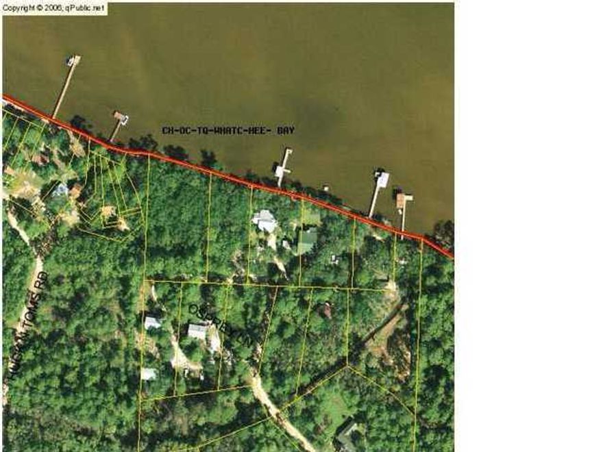 This lot has l25 ft on the bay with seawall in place Very nice, beautiful level lot with many old oak and magnolia trees.Chat Holly is in the process of being repaved along with a walking-bike path added. Listing agent is related to the seller.