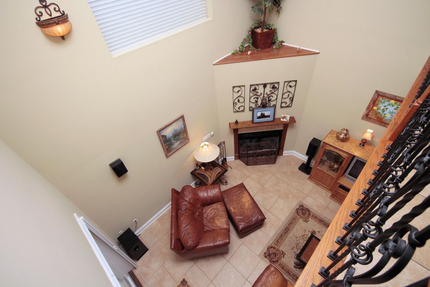 Everything about this home is GRAND and SPACIOUS. Starting with the cobblestone driveway that leads into an oversized 2 car garage. The entrance boasts with natural light and grandeur as you enter through the double doors adorned with large custom windows. The gleaming wood floors lead you into a stately room with columns offering the option of a formal dining table or a posh pool table. Around the corner is a majestic kitchen with granite counter tops, solid wood cabinets, a large breakfast bar and a spectacular custom Tuscan style hood range. It overlooks the living area on the ground floor, creating an open and expansive feel. The large living area has its own granite topped wet bar complete with a mini fridge, so you don't have to go far from the fire to top off your Manhattan. French doors lead out to a covered patio with a wooded view and steps leading to the lake. The master bedroom has recessed mood lighting with a dimmer switch and a walk in closet. The luxurious master bath has an extra large tub and a separate walk in shower. The wine cellar and library have built in custom shelving that send the class of this home over the top. It's located in a gated community in Bluewater Bay close to schools, shopping, Niceville's best restaurants and only 10 minutes to Destin's gorgeous beaches. This is the home to let your sophistication shine.