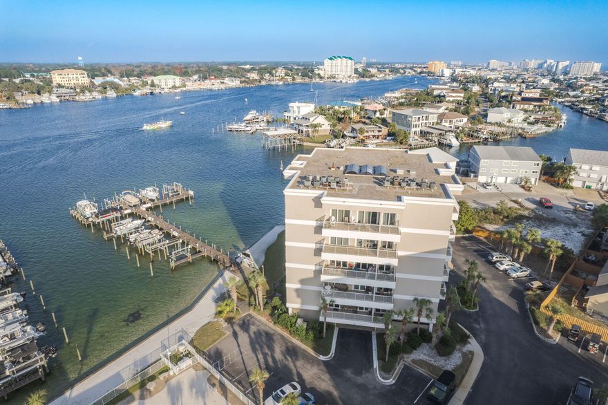 This hidden gem is part of the Sun King Towers and Yacht Club, a gated twin tower complex directly on the fabulous Destin Harbor and canal. Just minutes by boat or water taxi to local restaurants and the famous Crab Island, this condo offers a relaxed, beach-centric lifestyle with ample recreational opportunities. This lovely two-bedroom, condo is turnkey ''Move-in Ready'' and comes fully furnished, including furniture, ROKU TVs, artwork, and appliances in the living room, dining room, bedrooms, and kitchen The interior features easy-to-maintain luxury vinyl plank floors throughout, freshly painted cabinets, and custom window treatments. The kitchen is a delight with its granite countertops, breakfast bar, stainless steel appliances, and a handy pantry for extra storage. Enjoy the spacious living room with expansive views, which leads to a large balcony, perfect for relaxing or entertaining. The second balcony off one of the bedrooms provides stunning views of Destin Harbor.

You'll appreciate the convenience of a stackable laundry space, a custom, walk-in California Closet, and ample storage options with multiple closets.
