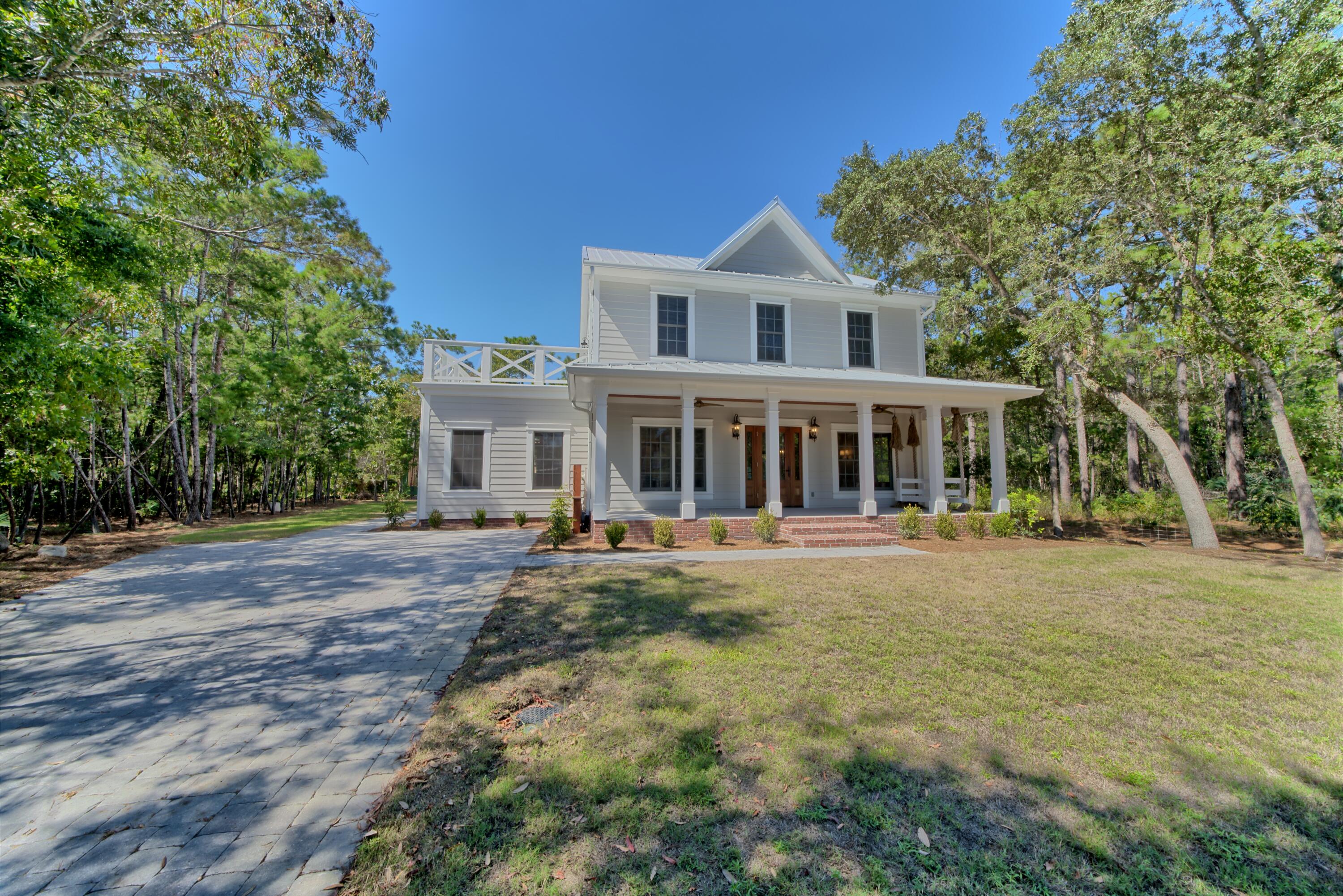 HIGHEST AND BEST OFFER BY 7/10/23. This home appraised for $1,600,000. Don't miss this opportunity! Unbelievable investment, permanent or secondary home on 30A. A Beautiful 4 bedroom 3 1/2 bath home located in a wooded Cul-de sac adjacent to a state park. Enjoy your private beach access with golf cart parking. This home has a new HVAC, huge screened in porch, large lot, tankless water heater, new floors, new siding, metal roof, new Plumbing and new electrical. The master is on the main with three bedrooms upstairs and a sundeck located on the second level. The attic is finished with heating and air. Large lot with an outside storage building and plenty of room for a pool.