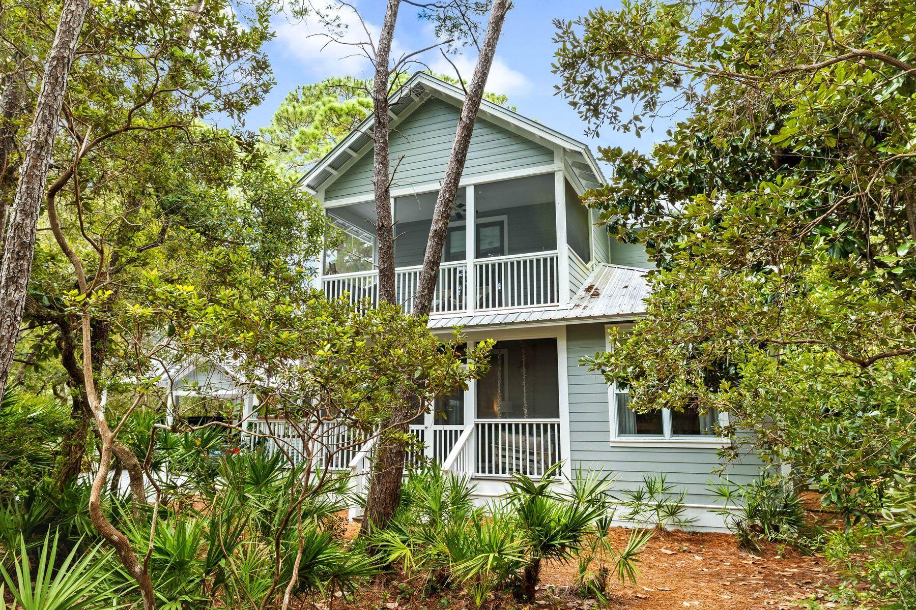 Contingency offer in hand ..but Still accepting offers. Nestled on over half an acre of lush, tree-filled land, this well-maintained Florida-style home offers the perfect blend of privacy and relaxation. Situated in a serene Bayfront community, this property features multiple porches--some screened--in which to enjoy peaceful days and nights. Just 4 miles from the sugar-white sands of the Gulf of Mexico, Grayton Beach, and the vibrant 30A area, including Seaside, the location is ideal for coastal living. The updated primary suite boasts new flooring and a spa-inspired bathroom with a spacious shower and soaking tub. Additionally, a large auxiliary building offers versatile space--perfect for a studio, or easily converted into a mother-in-law cottage. . The expansive lot is perfect for adding a pool, and the circular driveway provides added privacy.from the road. A fenced backyard is ideal for pets or outdoor activities.For water enthusiasts, the property offers easy access to the community Bay, perfect for kayaking, canoeing, fishing, or simply relaxing on the dock while enjoying stunning bay views. This home truly combines comfort, charm, and coastal living at its finest