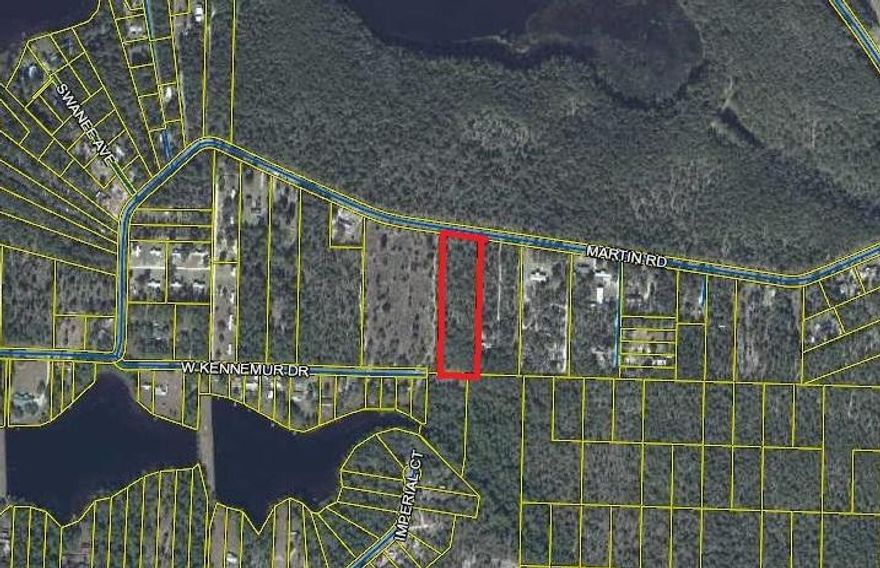 Approximately 4 acres on a paved road only  5 minutes from town. Level  lightly wooded acreage. Must see.  Several nice lakes and parks in the area.  Less than an hour to the beach.  Rural setting close to town.