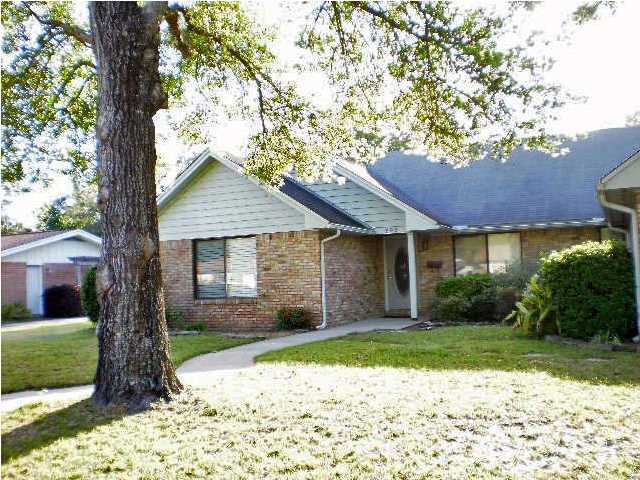 Waterfront views without the waterfront price. This lovely 3 bedroom home overlooks the bayou, and has a beautiful in ground pool. Split bedroom plan with two full baths, an eat-in kitchen and a dining room, living room and screened enclosed back patio. The living room looks out over the pool and the bayou, and features a large brick fireplace. One of the bedrooms has French Doors and would be ideal for an office/den. Interior laundry and a two car garage. Pool service is included in the rent. No Smoking Allowed!!