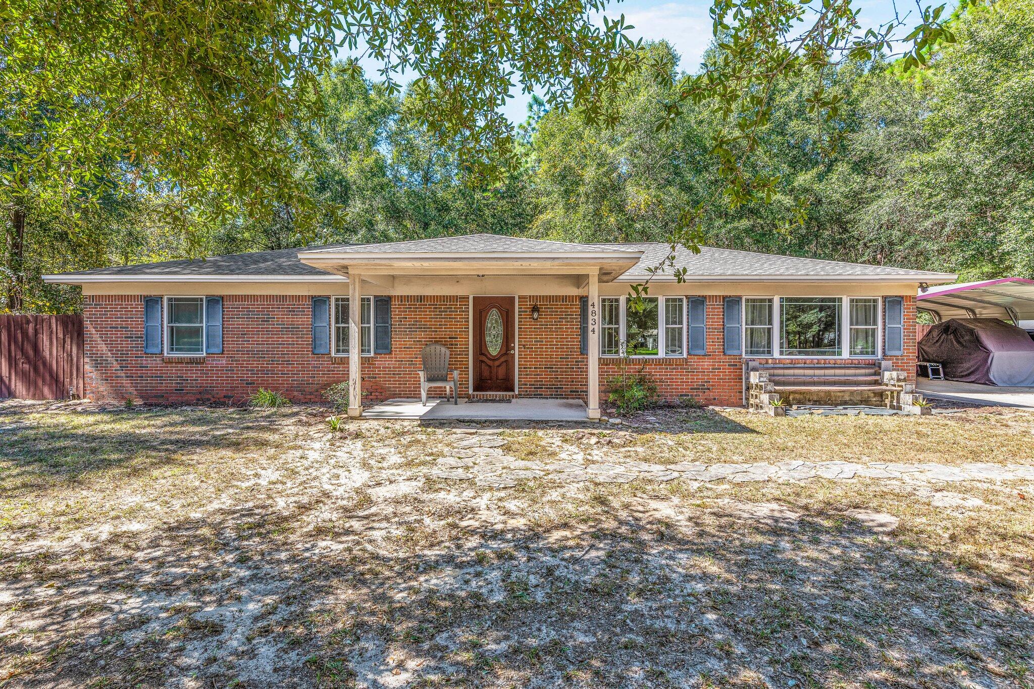 Come check out this beautiful 3 bedroom, 2 bathroom home in Southeast Crestview. This home has been extensively remodeled and exquisitely maintained, with an effective year of 2010, complete with a brand new AC unit in 2022. The opportunities are endless in your large backyard, with so much potential on your property of 0.98 acres. In close proximity to the local military bases, this home is also South of I-10, and a short drive to many new developments in Crestview. The kitchen flows into the living room with ample space for a dining room table, and also close to the oversized laundry room. Down the hallway you will find the bedrooms and one guest bathroom, complete with the master bedroom with ensuite full bathroom and updated shower. Make an appointment to see this stunning home today!