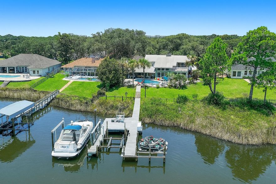 Welcome to 142 Indian Bayou Drive, a beautifully upgraded 4-bedroom, 4-bath waterfront home nestled in one of Destin's most desirable communities. Positioned along a deep-water bayou with direct access to the Choctawhatchee Bay, this residence offers a rare combination of elegance, privacy, and lifestyle--perfect for boating, entertaining, or simply enjoying the serenity of coastal living.The home features over 3,600 square feet of well-designed living space with an open layout ideal for gatherings. The main-level primary suite overlooks the water, while expansive living and dining areas flow seamlessly to a heated pool and a lush backyard framed by water views. A brand-new brick paver driveway, valued at $60,000, creates a grand entrance and enhances the home's curb appeal. Additional upgrades include a whole-house Generac generator, a paid-in-full solar panel system for energy efficiency, a new lawn pump, and fresh zoysia grass throughout the front and back yards.

A dedicated theater room offers a versatile space for entertainment or could easily be converted back to a bedroom. It also includes a unique play loft above. The mini refrigerator, stereo system, and furniture in the theater room are negotiable.

Boating enthusiasts will appreciate the home's well-equipped waterfront setup, featuring two boat lifts. The main slip includes a 25,000-pound lift designed to accommodate up to a 15 x 40 boat. The second lift is rated for 12,000 pounds and can support a vessel up to 13 x 27. The bottom of the included 2013 Sea Ray 370 Venture was professionally painted two years ago, and the boat is available for purchase with the home at an additional $175,000 (valued at $225,000). The property also includes one jet ski lift and two drive-on jet ski docks. Two 2023 Jet Skisa Surf Pro and a Fishing Proare negotiable with an acceptable offer.

Located just steps from the Indian Bayou Golf & Country Club, residents can enjoy a semi-private 27-hole course, a driving range, chipping and putting greens, an onsite restaurant, and a welcoming clubhouse environment. The neighborhood also features sidewalks, mature landscaping, and a low-traffic feel, all while being minutes from Destin's world-famous beaches, HarborWalk Village, fine dining, shopping, and top-rated schools.

Whether you're seeking a full-time residence or a vacation retreat, this exceptional property combines coastal luxury, boating convenience, and country club living in one stunning package. Schedule your private tour today and experience the best of Destin

