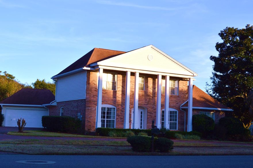 Located in Indian Bayou, this traditional brick home is meticulously maintained inside and outside. Six tall columns accent the front porch and provide an elegant passage into the home. This is an exceptional residence: brick paver driveway, detached garage, large lot with tropical landscaping, spacious office, solid wood flooring & tile flooring, wood-burning fireplace, casual dining space & formal dining, living room downstairs & great room upstairs, and nicely appointed kitchen. The master suite is downstairs and has double walk-in closets. At of the center of the upstairs is a large great room. Another smaller master is upstairs with its own bathroom. Two additional bedrooms share a third bathroom. Outside a large screened in porch overlooks a beautifully manicured lawn.