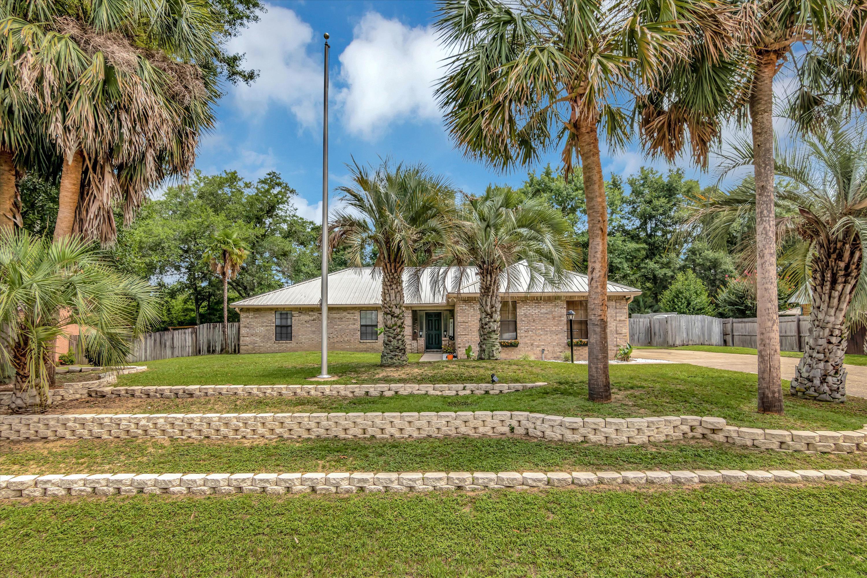 Multiple Offers - Seller Calling for Highest and Best by 3 PM on Sunday, 6/25/2023. Summer Fun in Sparkling New Above-Ground Pool! This well-maintained home in sought-after Plantation Oaks has a great open living concept. The main living area features attractive wood plank tile flooring in the family, kitchen, and dining areas. Centrally featured is a lovely dining island. The well appointed kitchen of course has a pantry. The laundry room is conveniently located nearby. This home has three spacious bedrooms and two full baths, making it perfect for your needs.The inviting backyard is ideal for hosting gatherings year round. Splish! Splash! Installed in 2022, is a brand new above-ground pool with a gorgeous brand new deck surround that the current owners are heartbroken to leave. One of the great things about this neighborhood is that it has underground utilities and no HOA, so you can truly make your house your own. Some other notable features of the property include a metal roof, a 2019 HVAC, a gas line for grilling outside, a private wooded area behind the house, an outdoor shed with A/C, no popcorn ceilings, a gas fireplace, and beautiful mature landscaping with palm trees. All this and you also get a spacious driveway with plenty of room for parking your recreational vehicles or all your guests' cars. It's Pool Time!