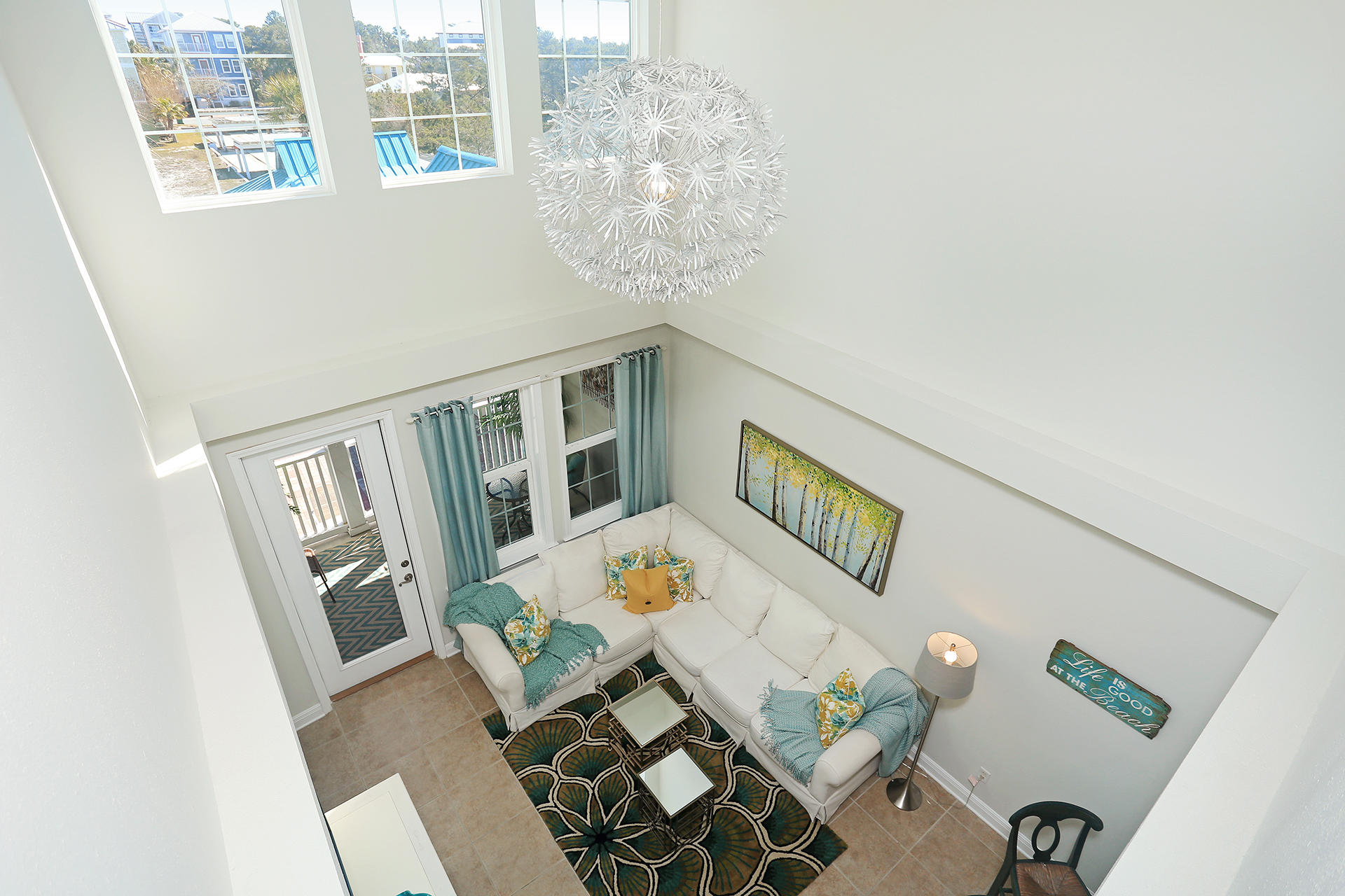 The 30A lifestyle can be yours! Experience toes in the sand, a cold beverage in hand and clear blue water. This spectacular 2nd floor condominium is fully FURNISHED. It is a rental ready 4-bedroom, 2.5-bath condominium that has been professionally styled and decorated. It features a spacious living area, and has a dedicated dining room. In addition there is a dry bar in the large foyer that provides a great place for preparing beverages. The master has a walk-in shower and large walk in closet. The two beautifully appointed upstairs guest rooms share a spacious bathroom. The furnished porch overlooking the pool provides a great outdoor area for entertaining, and the front porch is a cozy spot for watching beautiful sunsets.