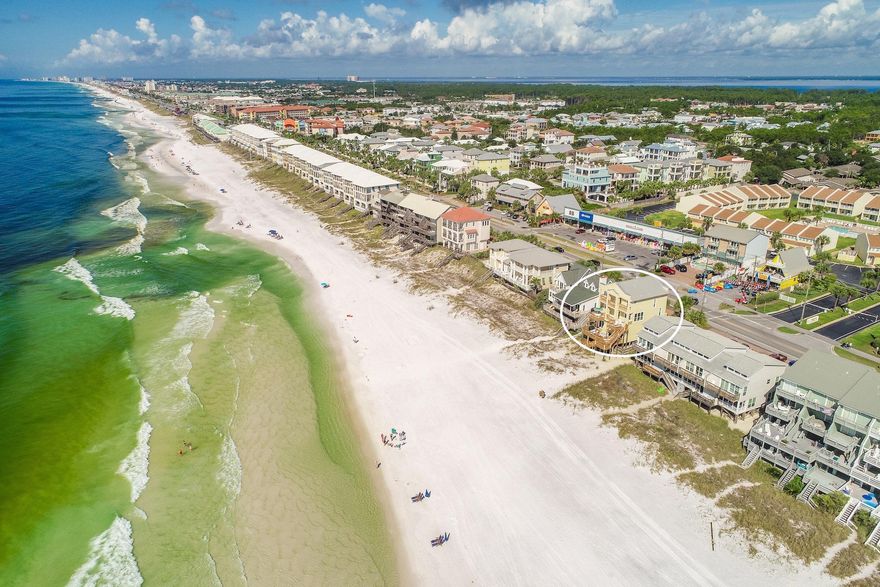 Experience unparalleled gulf front vistas from this prominently located beach front retreat primely positioned on 50' of premium linear gulf frontage highlighted by three stories of coveted south facing deck space. This exemplary five bedroom rental machine has been recently updated and well designed for optimal income potential offering $175,000-$200,000 projected gross annual income. Notable features include ample exterior parking as well as a spacious two car garage with additional storage for beach equipment. The open floorplan is an immediate highlight with a functional set up allowing for two spacious gulf front bedrooms on the first level sharing a jack-and-jill bathroom and allowing immediate access to the rear decks & subsequent path to the beach. The awe-spiring kitchen and