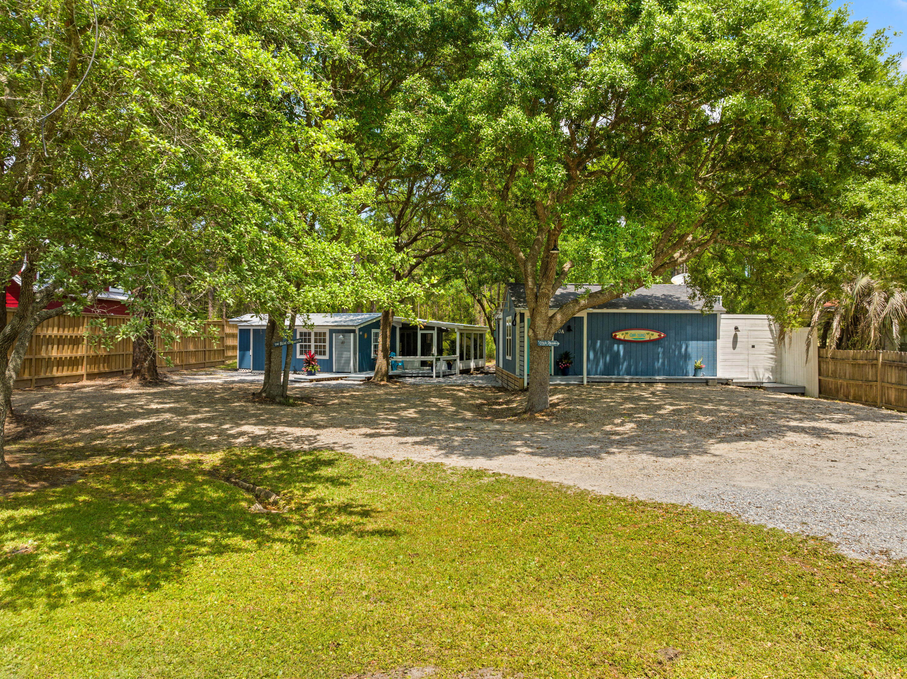 Price Improvement! This highly versatile, income-producing property is now offered at a reduced price, making it a rare find just minutes from 30A. Zoned for both short-term and long-term rentals, this opportunity offers flexibility and value rarely found this close to the beach--without the 30A price tag.Set on a .28-acre lot and bordered by a 255-acre conservation buffer that will never be developed, the property includes two fully furnished, coastal-inspired cottages plus a 30-amp RV hookup with sewer connection. With ample parking, no HOA, and room to add a pool or garden, the potential here is exceptional.The Blue Cottage features 2 bedrooms, 1 bath, 868 square feet of heated and cooled living space, plus a 178-square-foot screened porch, totaling 1,046 square feet of usable space. Recent updates include a 2023 metal roof, new kitchen appliances, island, countertops, flooring, interior and exterior paint, water heater, washer/dryer, and a new laundry room door. The cottage also includes a screened-in porch with a flat-screen TV, grilling deck, and is plumbed for a future outdoor shower, pool, or spa. The last long-term lease grossed $2,100 per month, and it grossed $29,000 as a short-term rental in 2023.
On the opposite side of the property sits "Crab Island," a one-bedroom, one-bath studio cottage built in 2014. The studio offers 350 square feet of interior space plus a 236-square-foot screened porch with large sliding glass doors that create an open-air flow between indoor and outdoor living. The porch features a sink, mini fridge, storage, and ceiling fans, making it ideal for entertaining. Additional features include a wraparound deck, outdoor shower, fenced backyard, and storage area. The studio grossed $19,000 as a short-term rental in 2023, and its last long-term lease brought in $1,650 per month.
Located just minutes from the white-sand beaches of South Walton, parks, Grand Boulevard, Miramar & Destin this property is ideal for investors, multi-generational living, or those seeking a personal retreat with strong rental income potential.