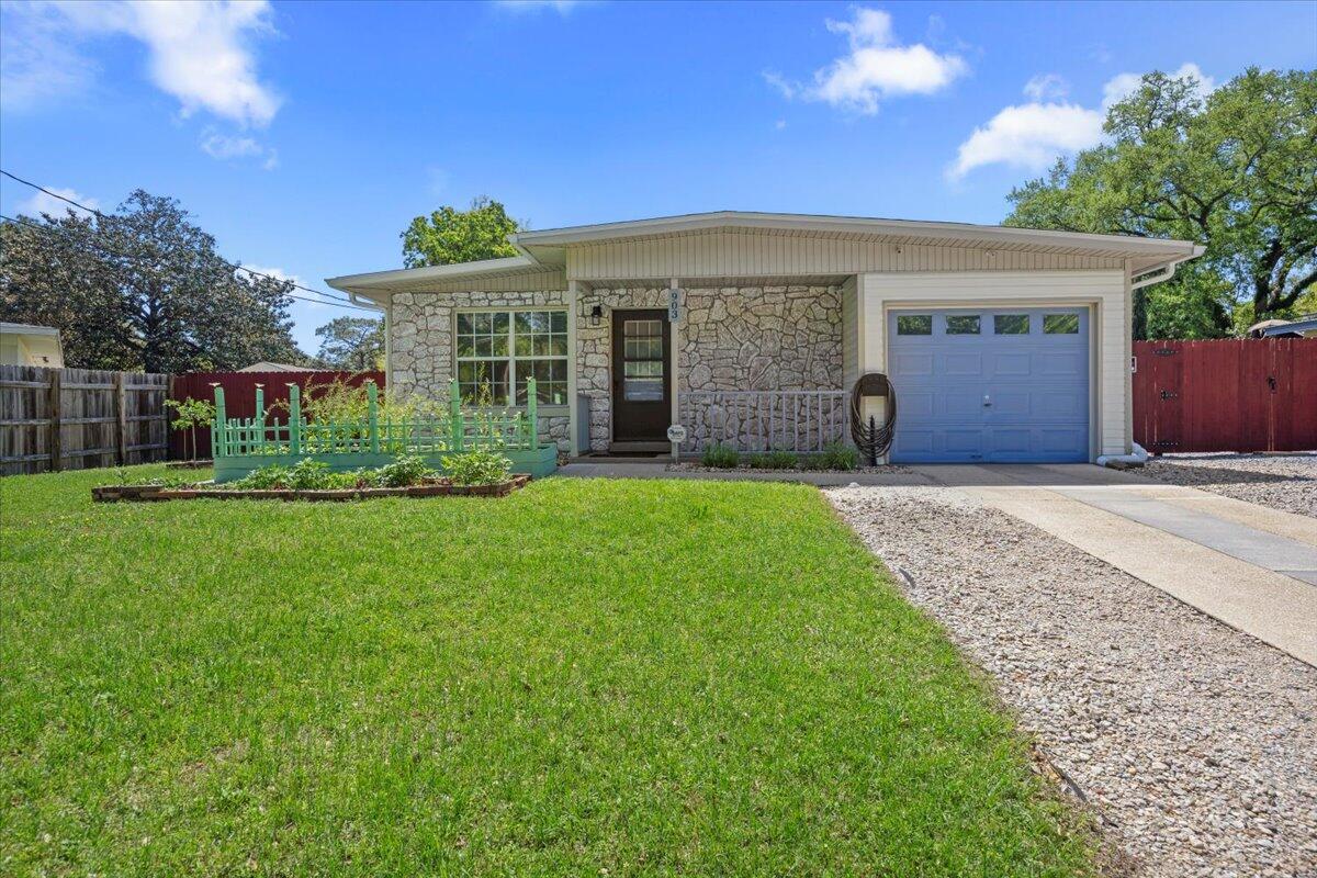 **BACK ON THE MARKET!!! through no fault of the Sellers.  Beautifully Renovated 3 Bed / 2 Bath Home with High-End Finishes, Thoughtful Design & Outdoor OasisThis stunning 3-bedroom, 2-bath home is not a flip--it was lovingly redesigned by the homeowners for their own enjoyment, with an emphasis on quality, comfort, and long-term durability. Every detail was chosen with care, using high-end materials and smart design to create a home built to last. A new roof installed in 2024 comes equipped with hurricane clips, 4-point wind mitigation, and secondary water resistance (SWR)providing excellent storm protection and potential insurance savings. All major systems have been fully updated, including HVAC, water heater, plumbing, and electrical, so you can move in with confidence.

Inside, you'll find brand-new porcelain ceramic flooring and a fully modernized kitchen showcasing elegant Nuage Quartzite countertops, stainless steel appliances, and sleek, contemporary cabinetry. The bathrooms have been beautifully upgraded to match the home's clean, cohesive style.

The generously sized master suite opens through double doors to your private backyard escape. Outdoors, enjoy a fully fenced yard with a tranquil aquatic pond, floating decks, and thoughtfully arranged raised beds ready for flowers or vegetables. A separate powered workshop and additional storage shed provide plenty of space for hobbies or organization.

At the back of the garage, the laundry and utility area shines with upgraded cabinetry, built-in shelving, ample storage, and a washer and dryerdesigned to keep everything neat and accessible.

This is more than a renovationit's a carefully crafted home designed for living well. A place for everything, and everything in its place. Come see the difference that true attention to detail makes.